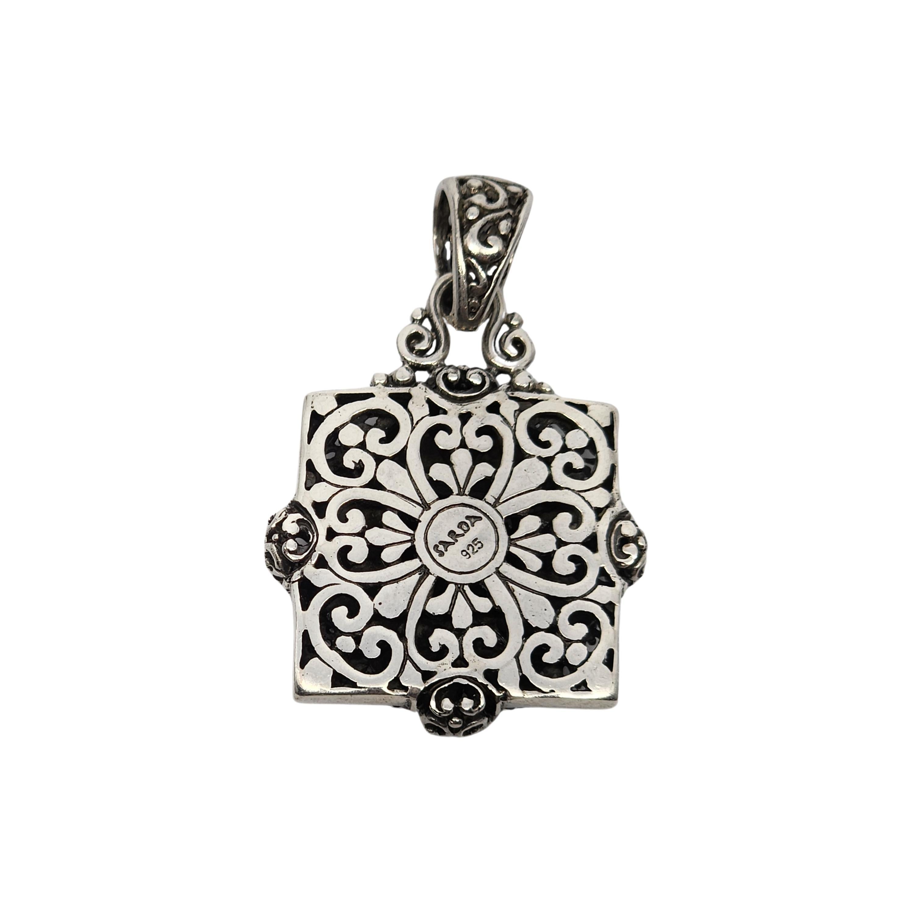 Sterling silver flower medallion pendant by Sarda.

A beautifully detailed and intricate flower design with cut-out scroll work bale.

Measures approx 1 3/4
