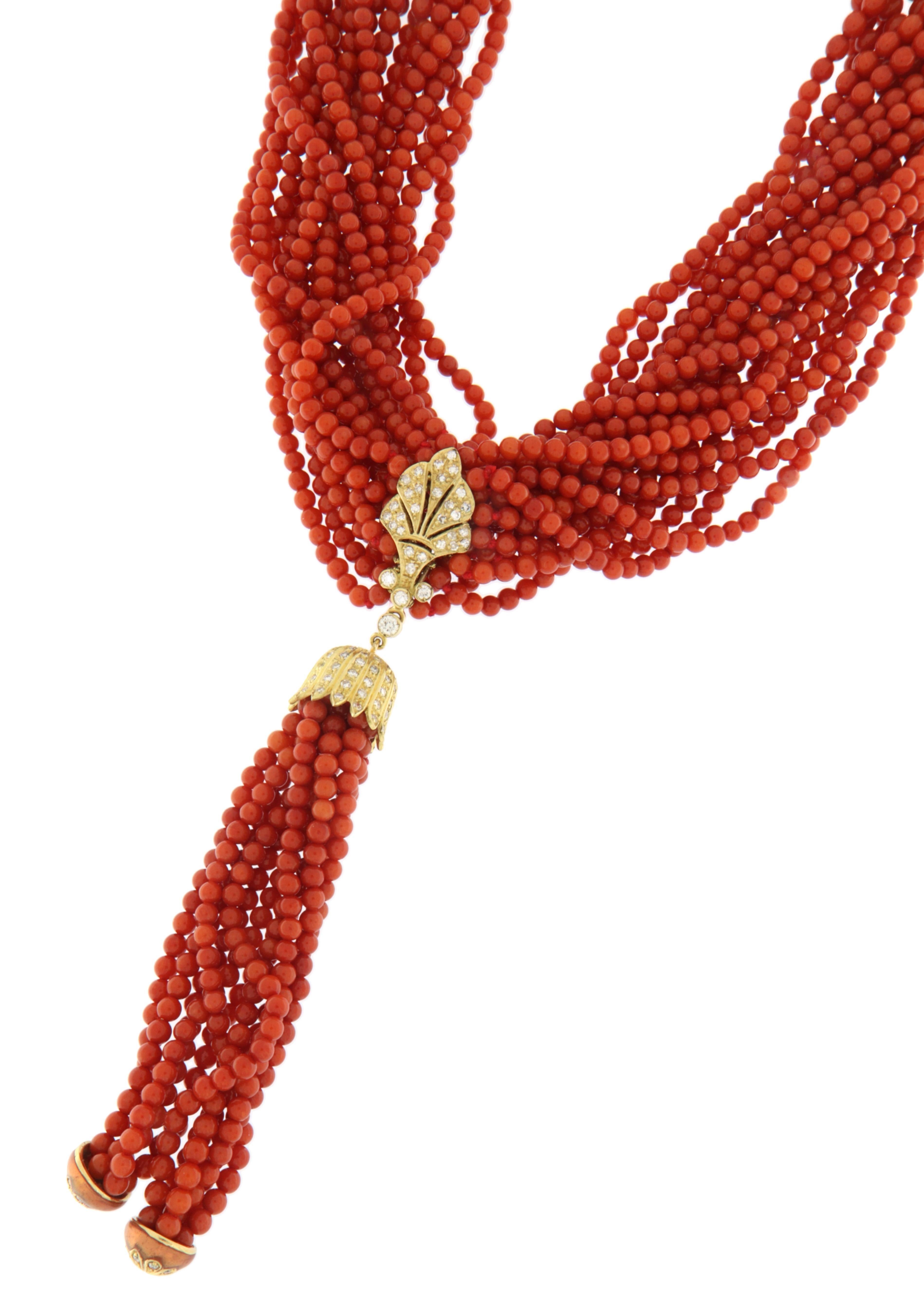 This magnificent necklace is a true masterpiece of Italian craftsmanship, made with natural Sardinian coral and detailed with 18-karat yellow gold. The multi-strand twist of carefully selected red coral beads creates a bold and dynamic effect,
