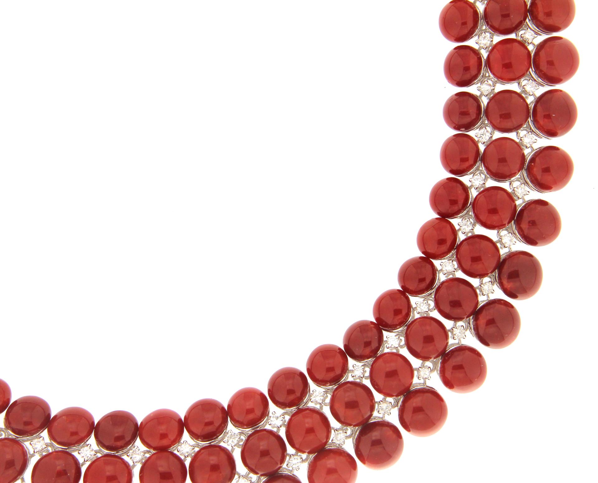 A stunning necklace crafted in 18K white gold, this high-class piece embodies elegance and sophistication. The design is enriched with a selection of natural Sardinian coral of the highest quality, distinguished by its deep red hue, a symbol of