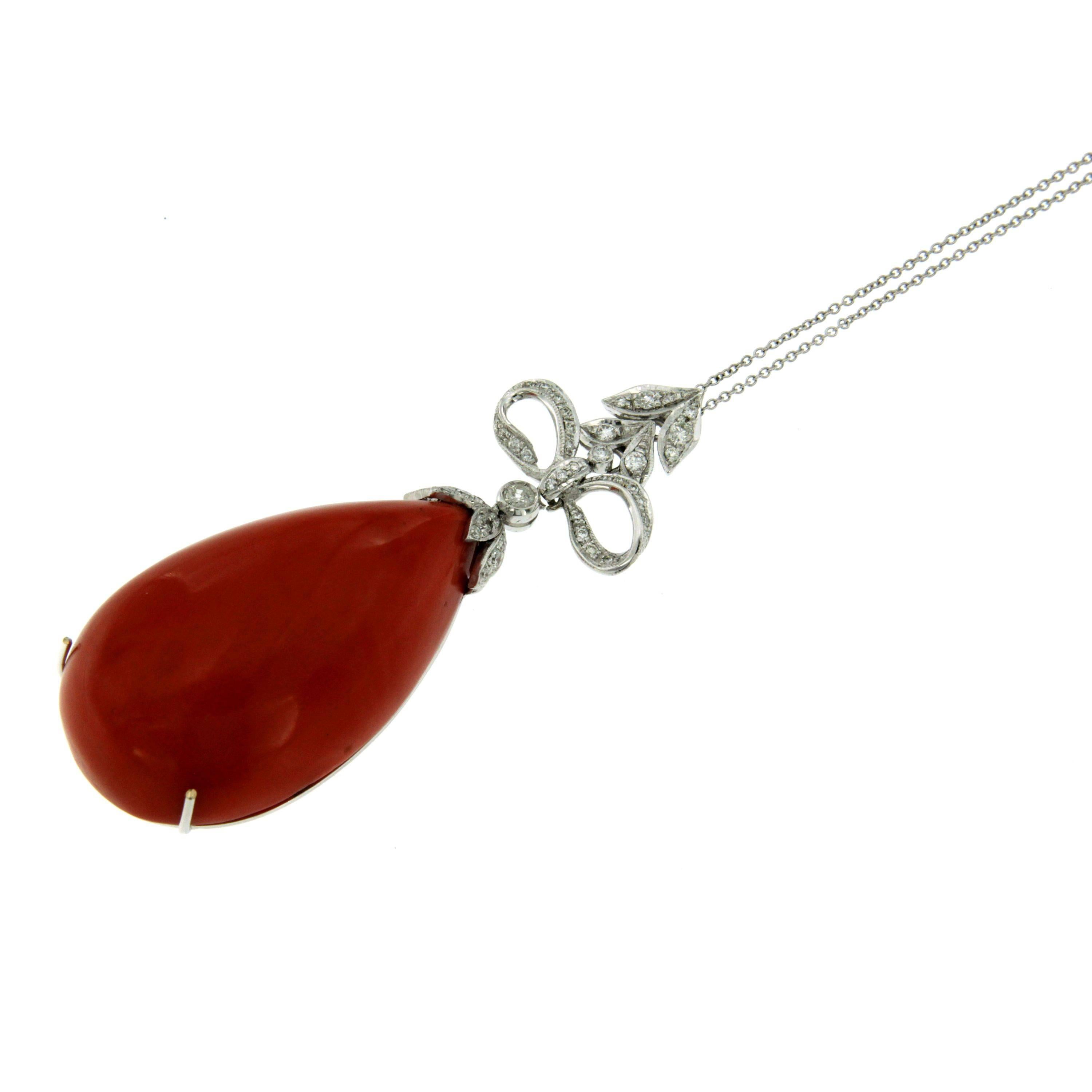 A stunning pendant featuring a natural pear shaped Mediterranean Coral, Sardinian variety, set with 1 ct. of round brilliant cut diamonds G color Vvs.
Exclusively hand crafted by great Italian masters craftsman from 18k. Circa 1980

CONDITION: