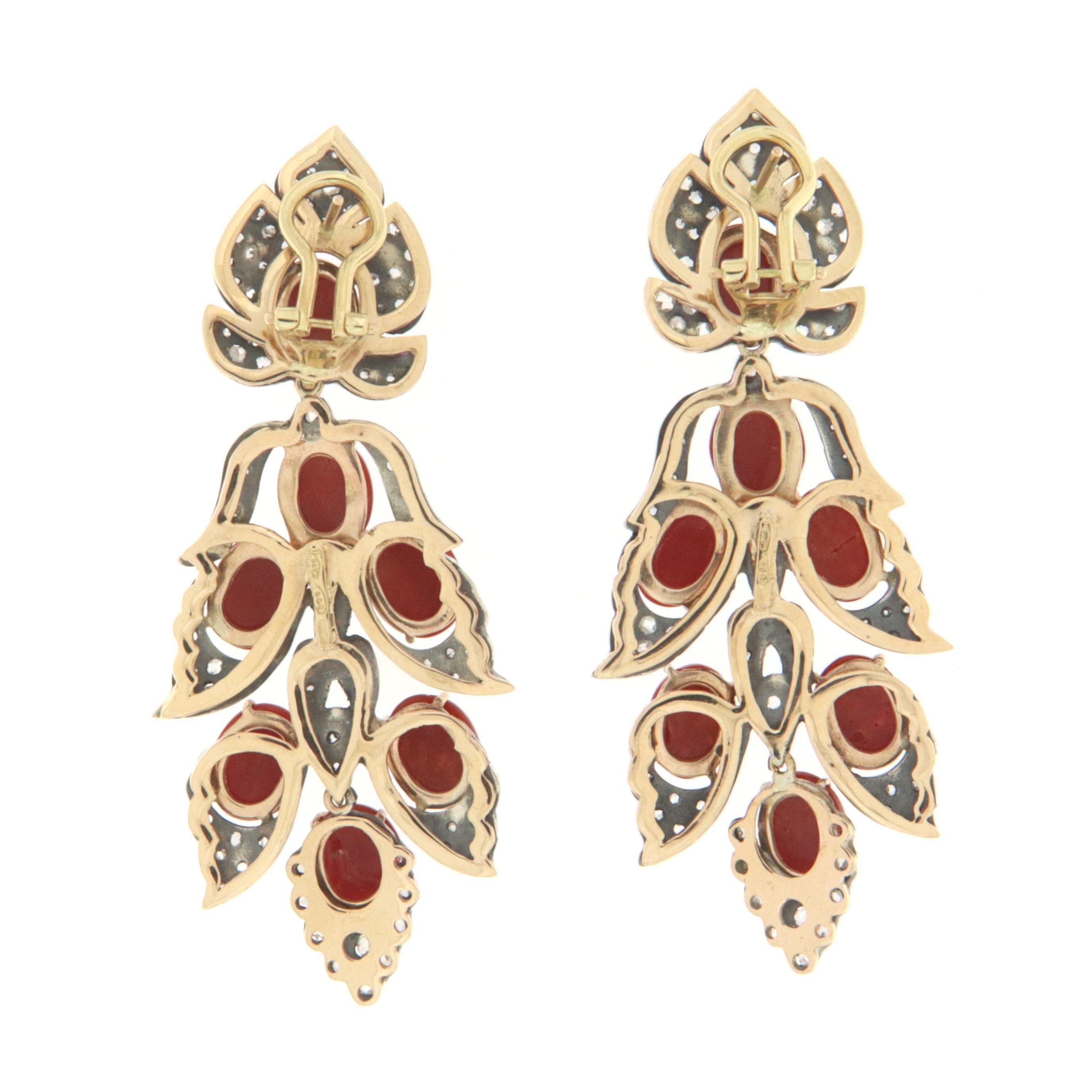 Amazing earrings in 14 karat yellow gold and 800 thousandths silver, 1950s style, Italian manufacture, mounted with old cut diamonds and Sardinian coral

Diamonds weight 1.93 karat
Coral weight 6 grams
Earrings total weight 33.30 grams