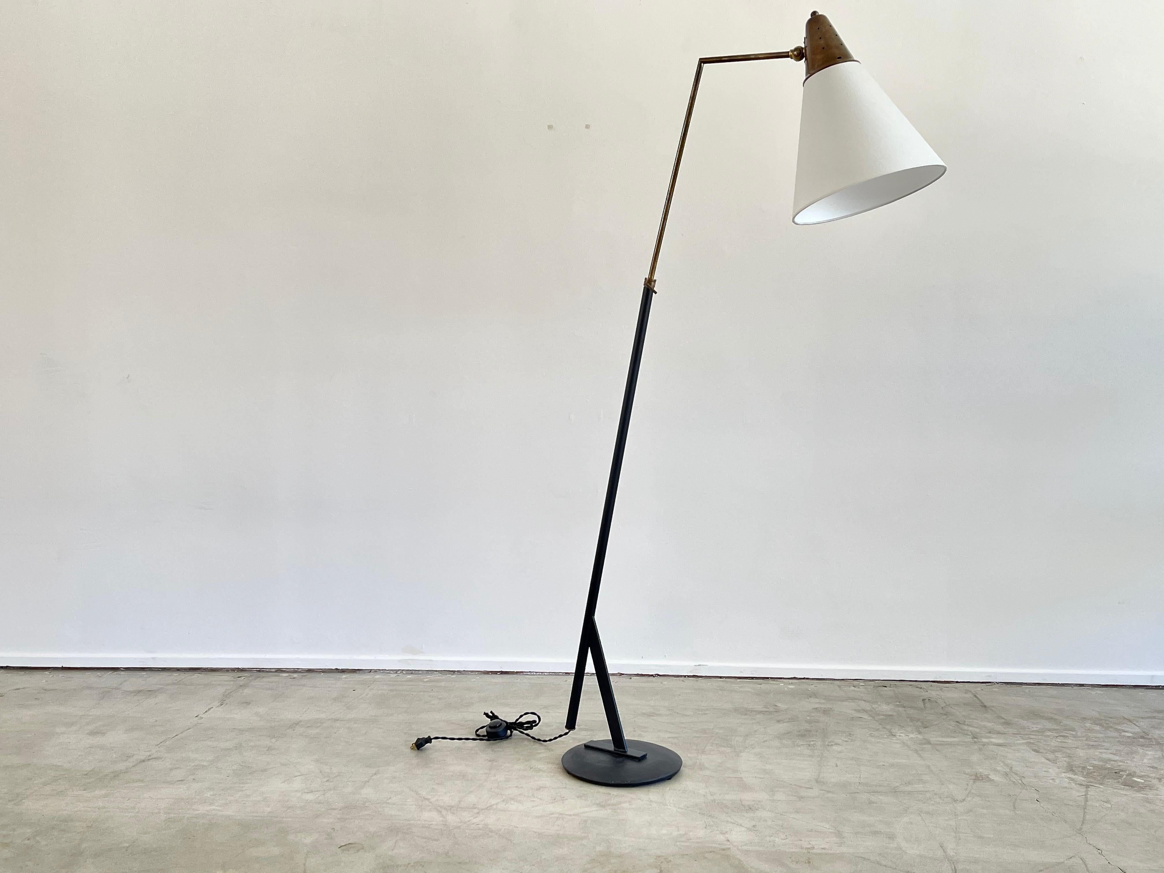 Sarfatti attributed floor lamp with perforated brass shade, angled iron frame and base with new silk shade. 
Newly rewired.