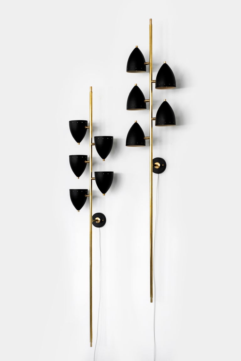 Fantastic newly produced large scale Italian sconces in the style of Sarfatti. Brass stem with black metal perforated cones that pivot for great directional light. Perfect statement piece for a large space! Priced and sold individually.