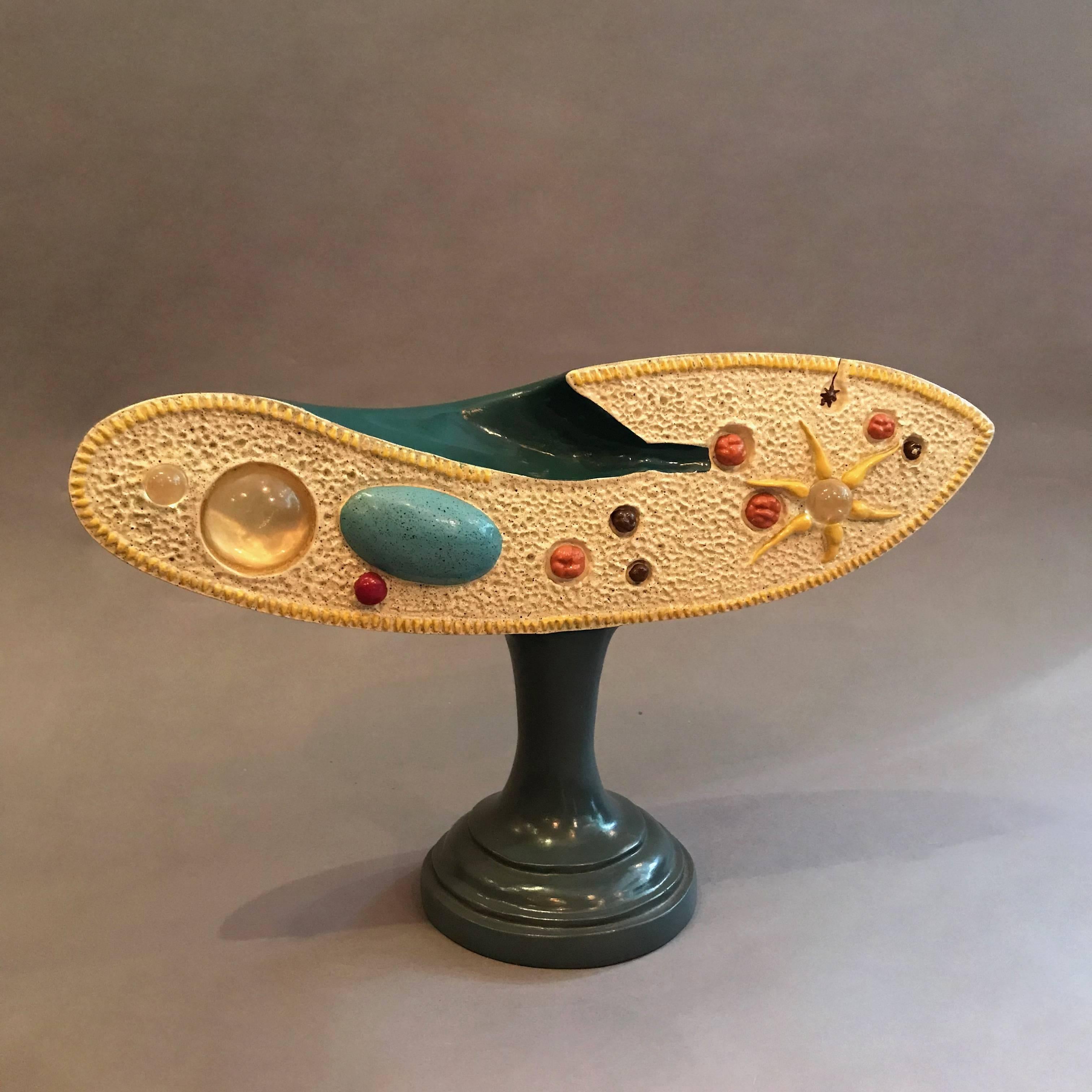 Painted resin composite, scientific, educational, zoological model of a paramecium - single-cell fresh water animal - by the Sargent Welch Scientific Company.

 