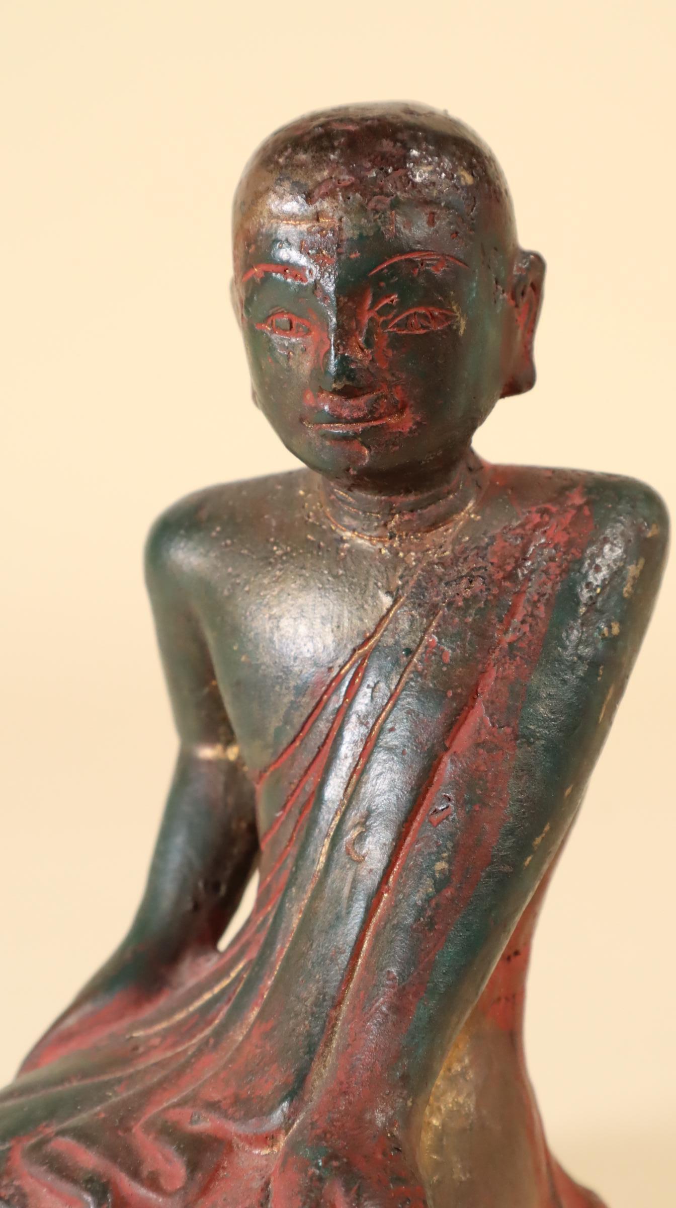 Store closing March 31. Last chance clearance sale.  A serene portrait of Sariputra, the Burmese (Myanmar) Buddhist saint and disciple of the Buddha, kneeling, leaning on his left arm in an attitude of peaceful listening, as traditional. Cast bronze