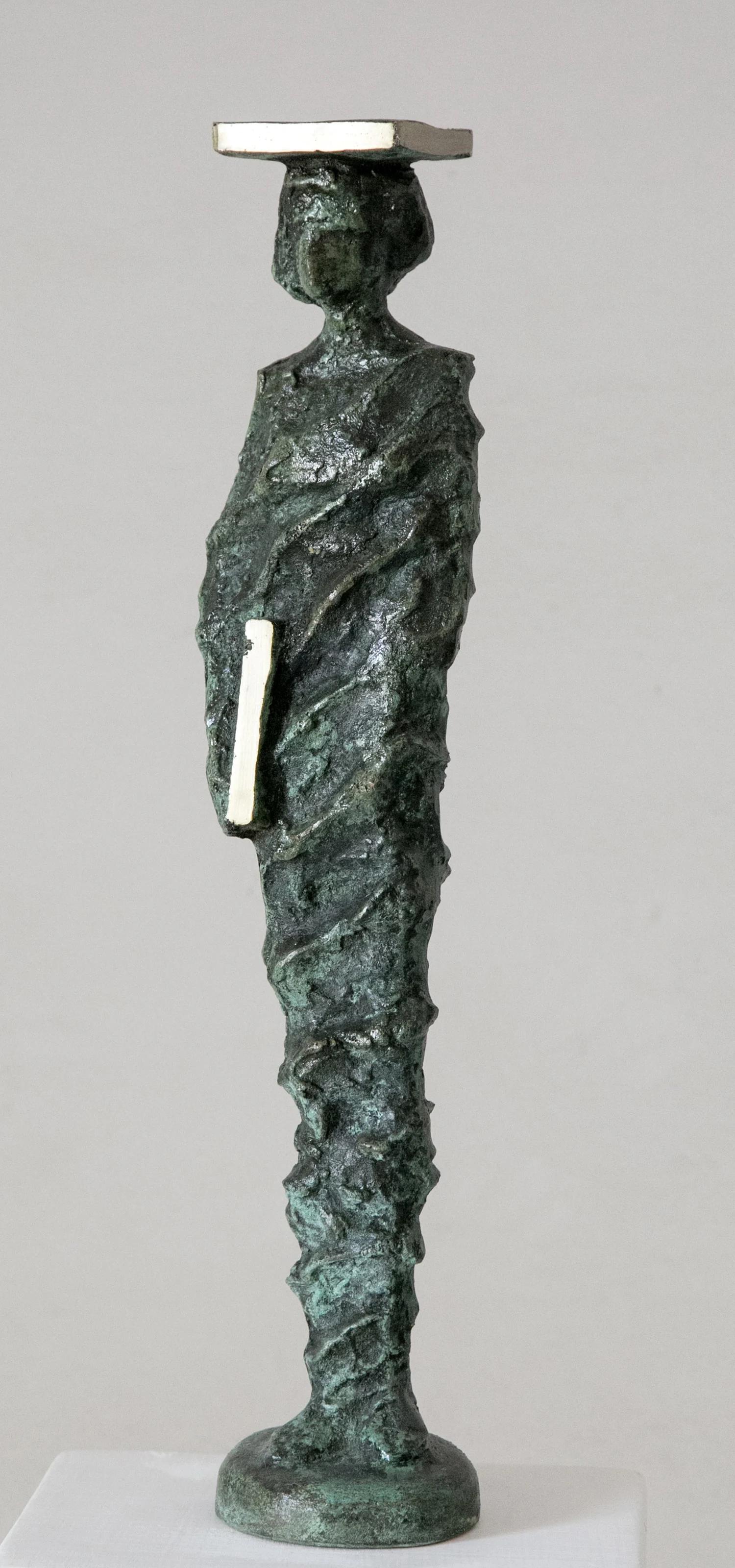 "Graduation I" Bronze Sculpture 19.5" x 4" x 3" inch by Sarkis Tossonian		

Sarkis Tossoonian was born in Alexandria in 1953. He graduated from the Faculty of Fine Arts/Sculpture in 1979. He started exhibiting in individual and group exhibitions in