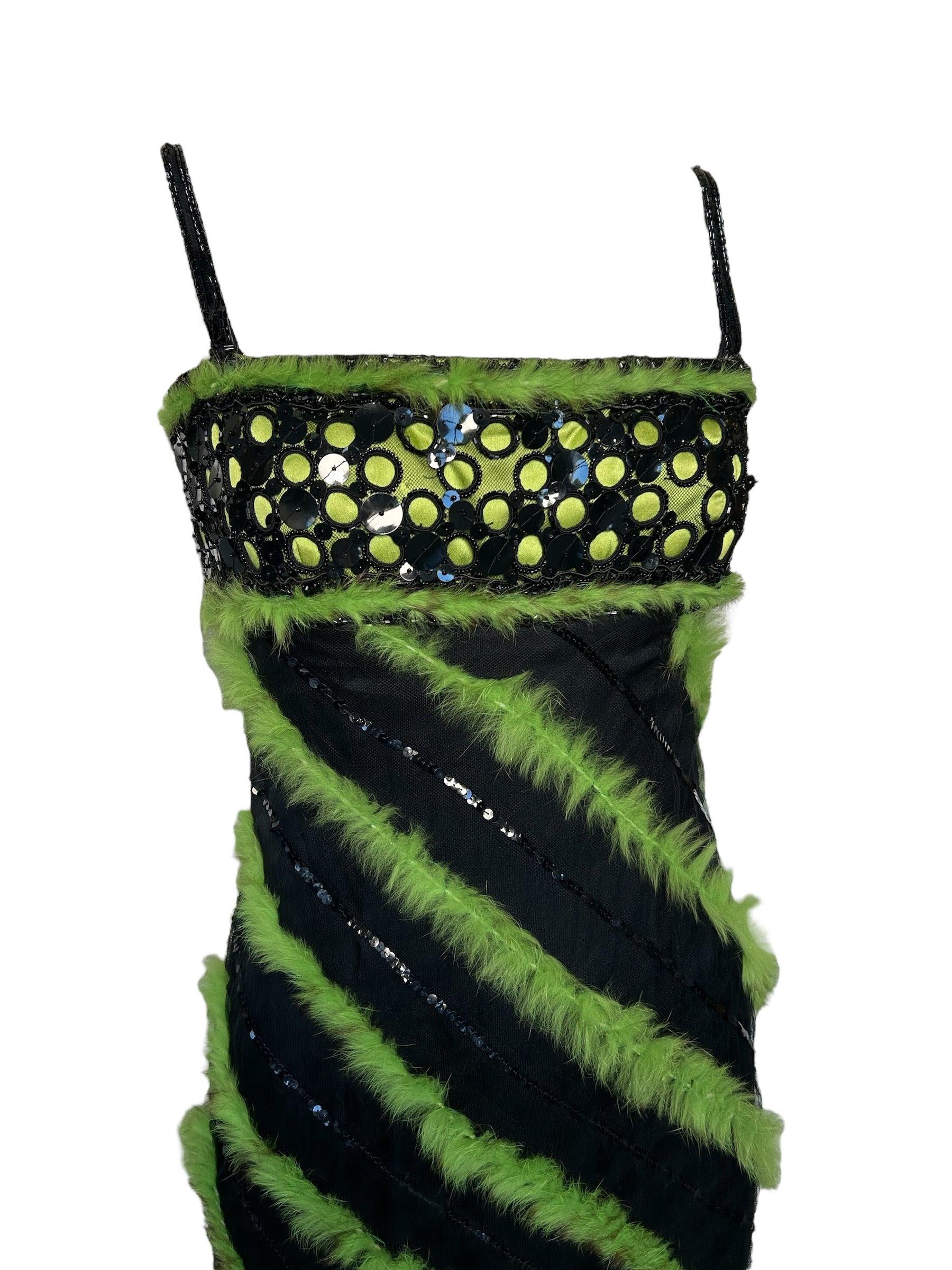Unleash your wild side with this striking green and black gown! The unique rabbit fur stripes add texture and intrigue to the mesh exterior, while sequins provide a touch of shimmer. The inner zipper corset and beaded straps provide a secure and