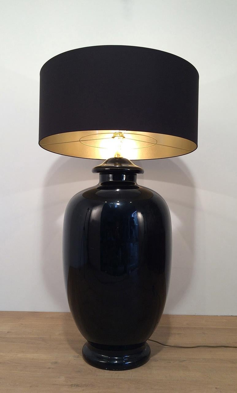 This important lamp is made of black enameled ceramic and gilt brass. This is an Italian work signed Saronno, Italy. Circa 1960.