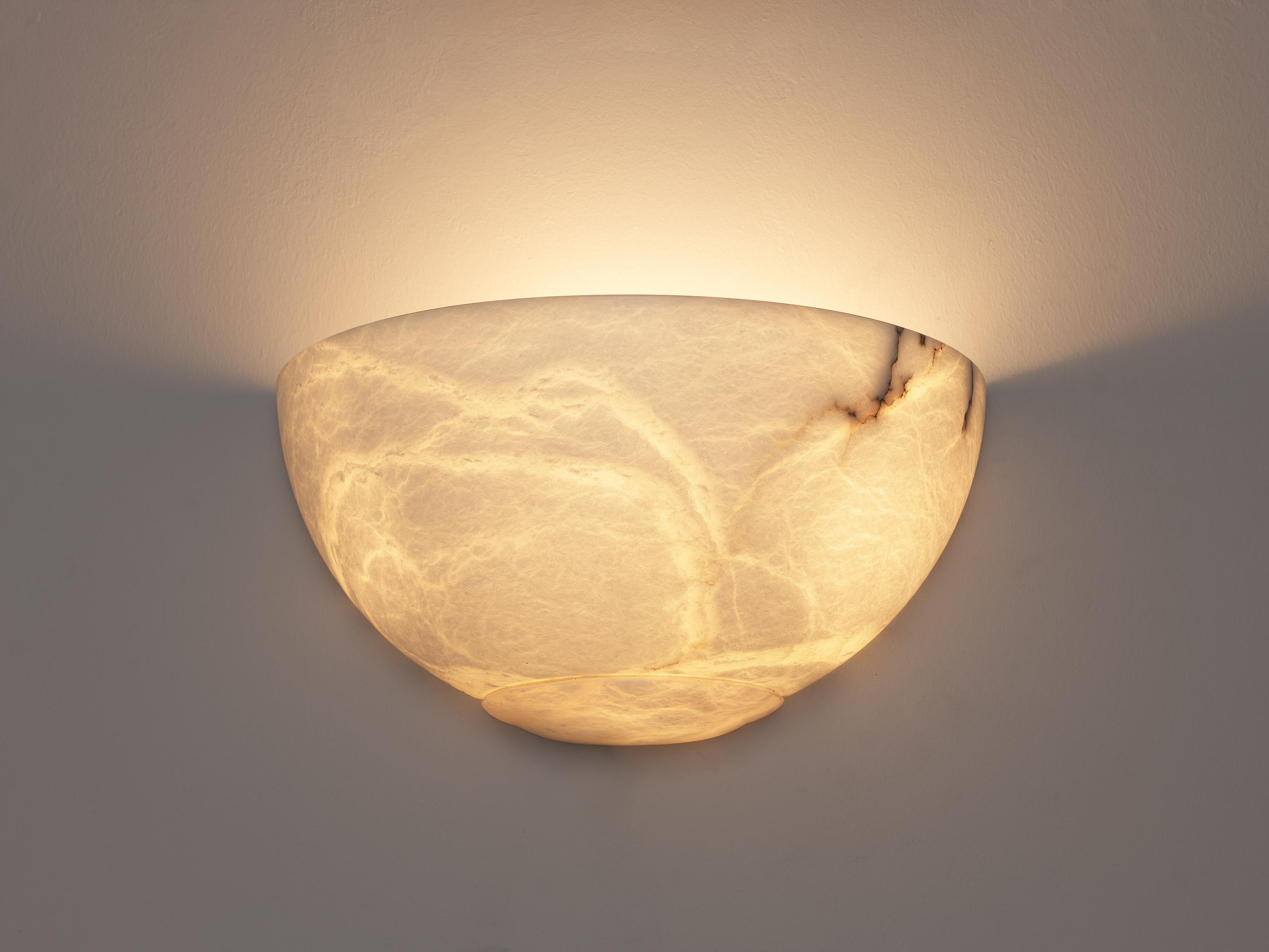 Sarreal Art, wall light, alabaster, Spain, 1970s

Very elegant sconce by Sarreal Art, designed in the late 1970s. The sconce is made out of alabaster, which results in a beautiful range in shades of light through the material. The light cracks have