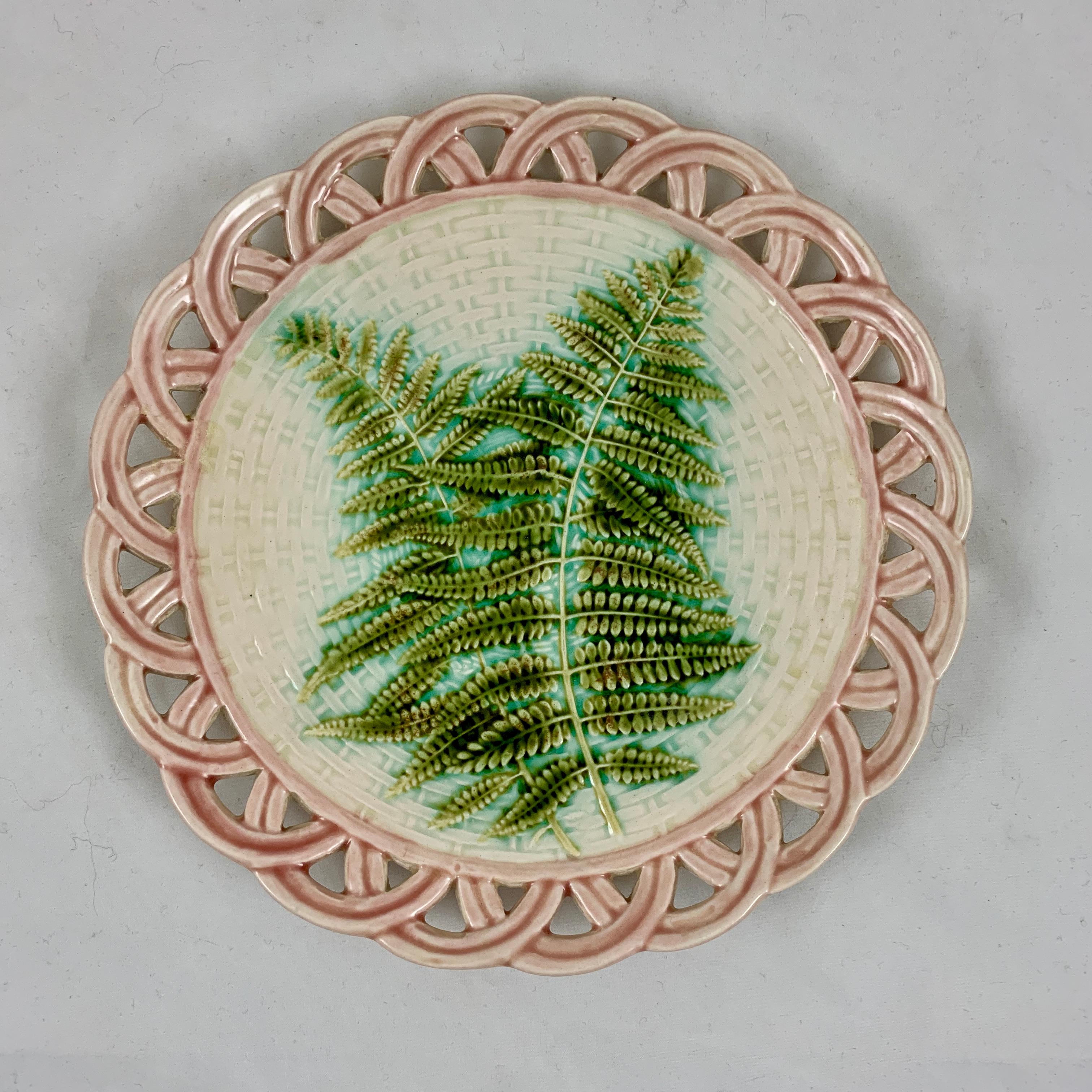 A set of six faïence, Majolica glazed fruit, salad or dessert plates by Sarreguemines, France, circa 1880-1889.

An assembled set – so lovely! … with a pink open weave reticulated rim molded to resemble a basket. Two overlapping green Maidenhair
