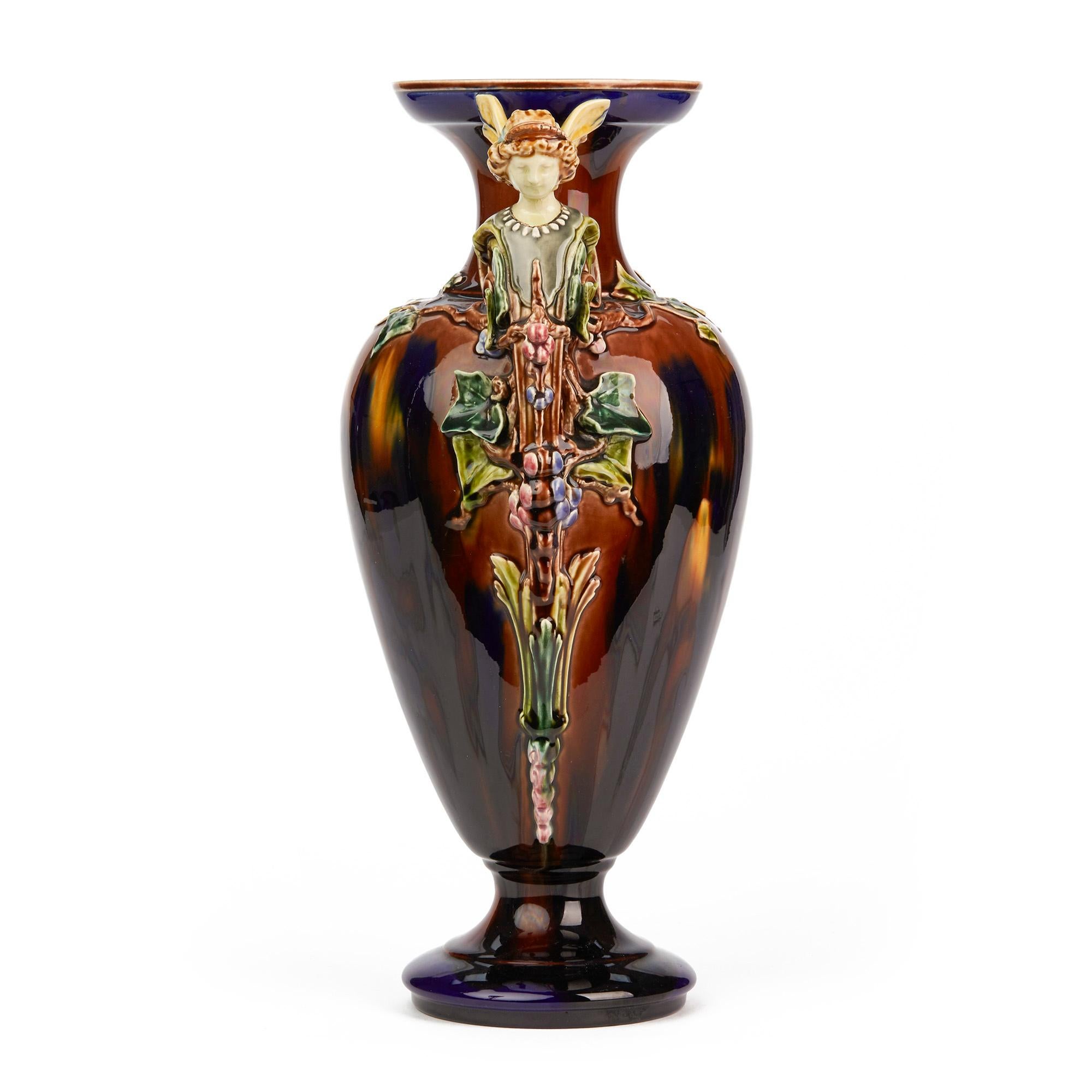 A large and exceptional French Majolica vase applied with maiden handles and decorated in beautiful streaked glazes by Sarreguemines. This rare example was probably an exhibition piece with a tall elegant shaped body and with handles formed as noble