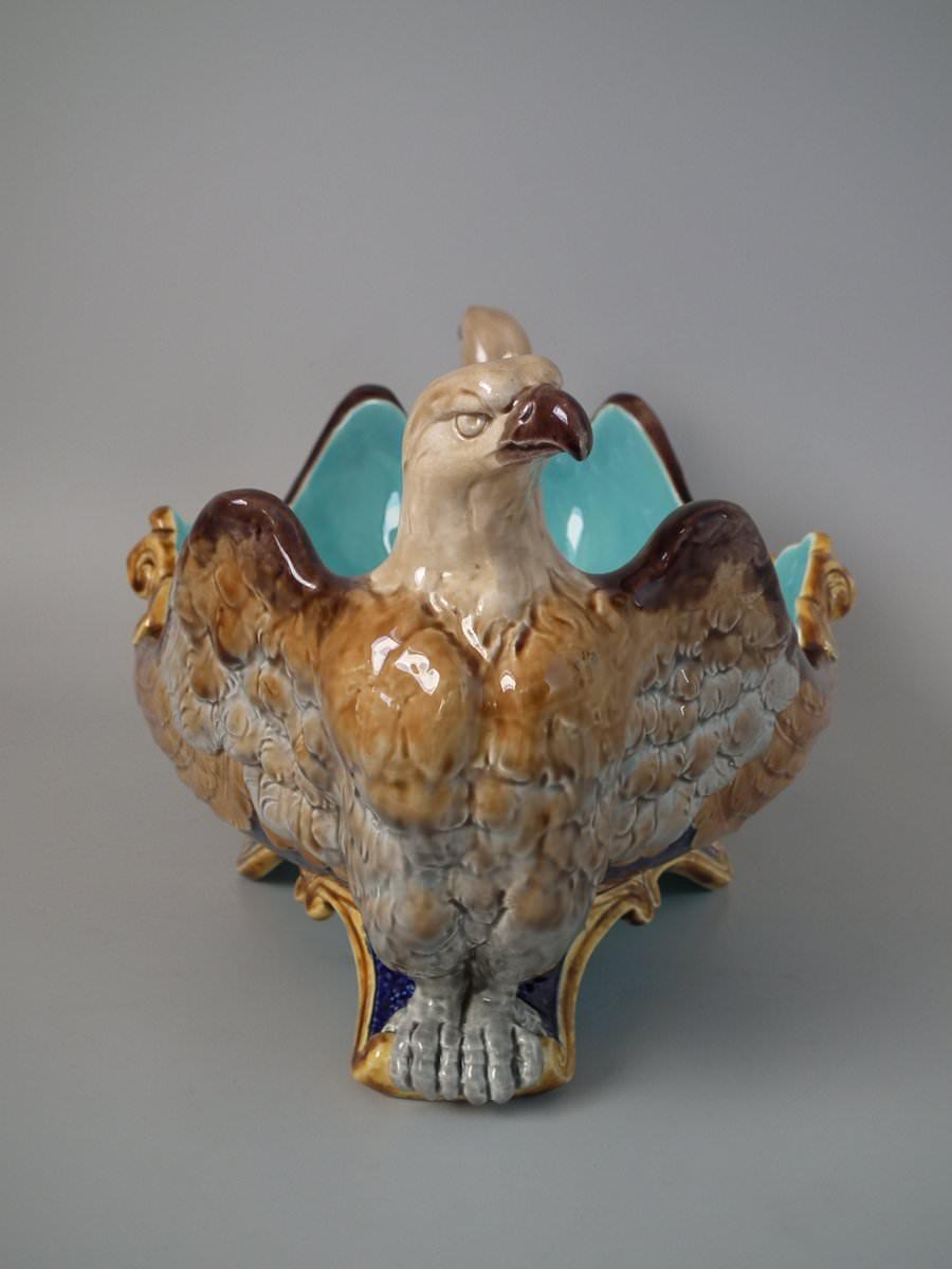 Sarreguemines Majolica centrepiece bowl which features eagle handles at either end, the wings along the sides. Colouration: turquoise, cobalt blue, brown, are predominant. The piece bears maker's marks for the Sarreguemines Pottery. Bears a pattern