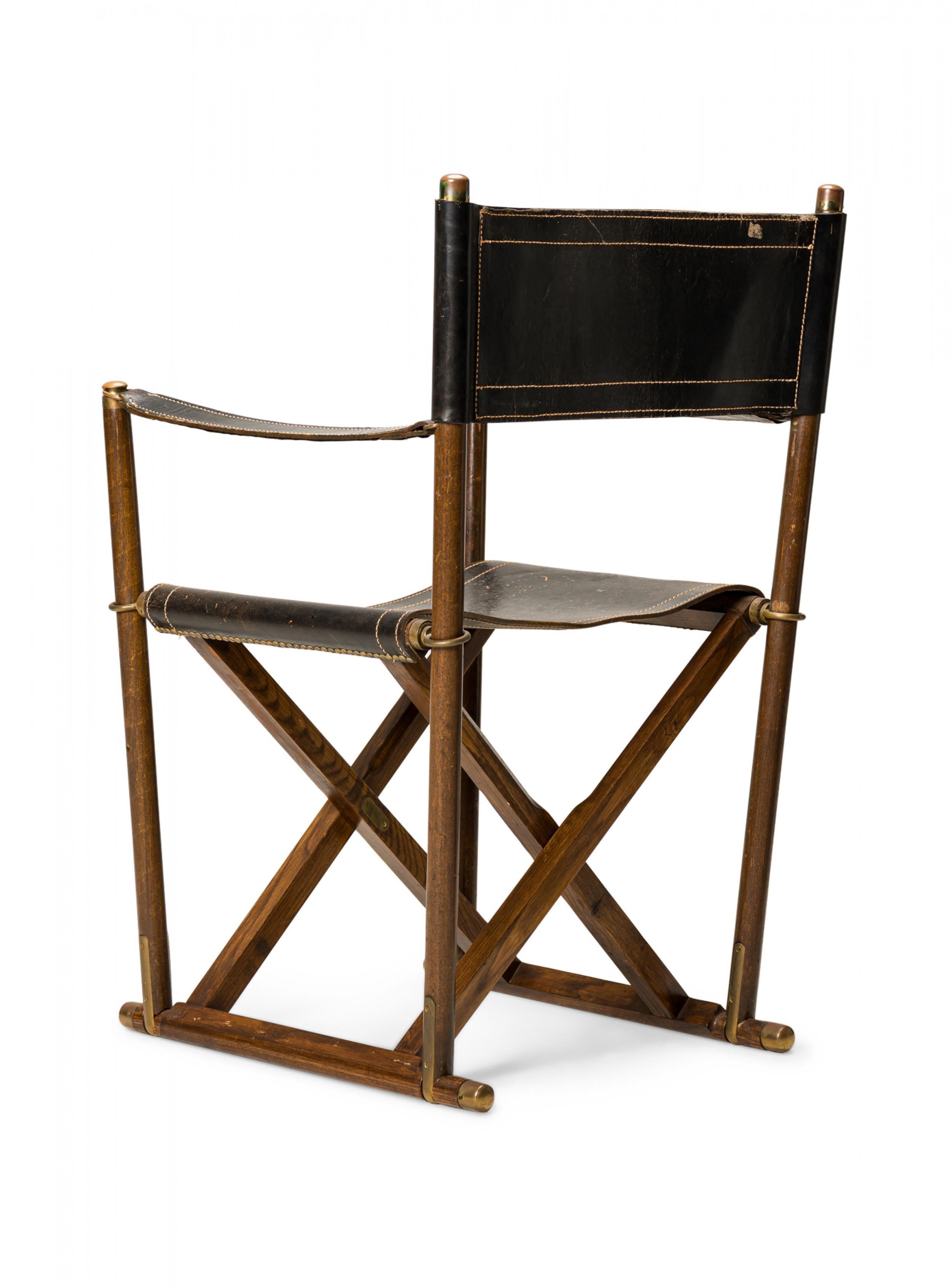 American Mid-Century folding campaign / director's chair with walnut frames and black stitched leather sling back, seat, and arm. (SARREID