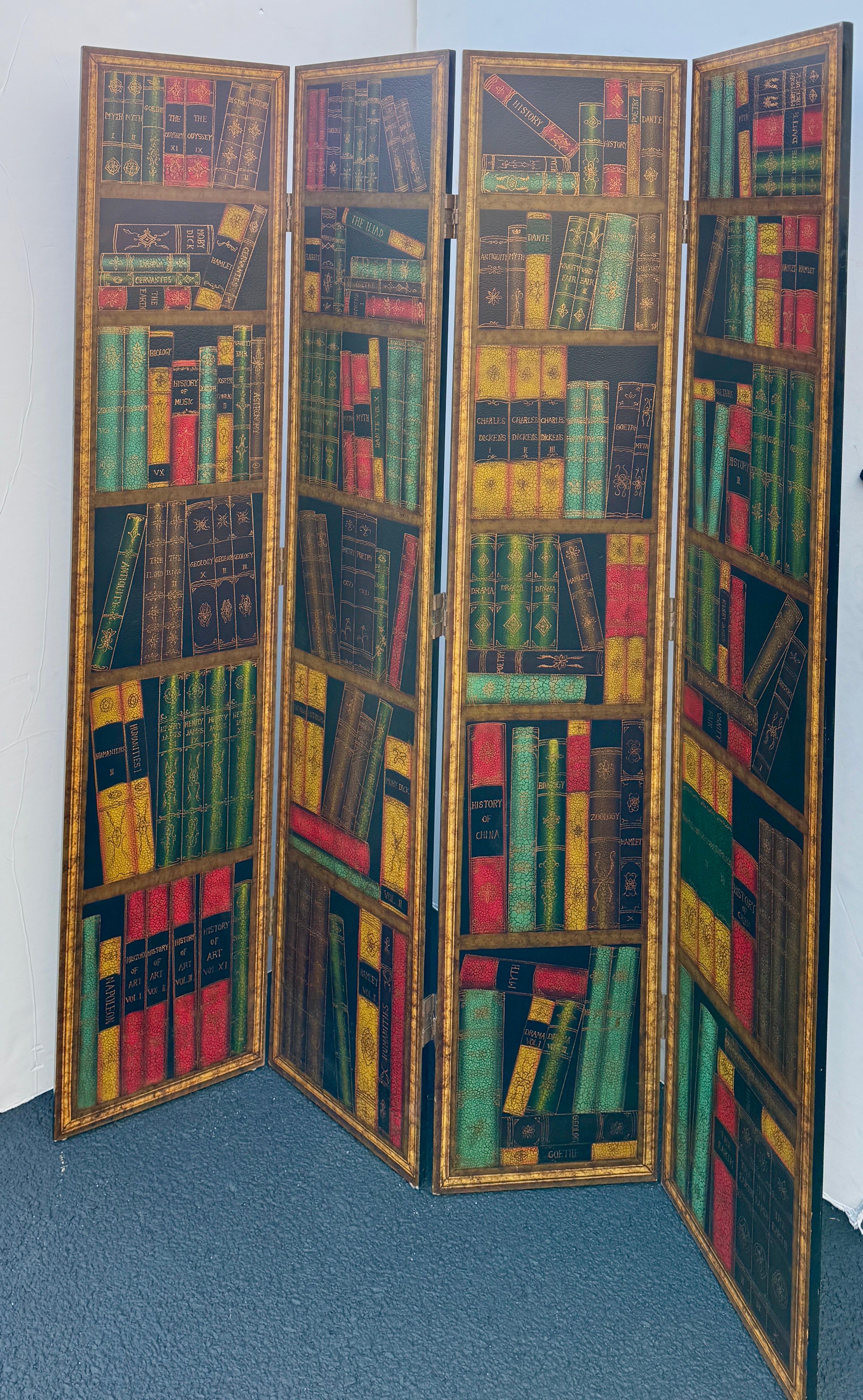 An impressive 4 panel Trompe L'Oeil screen or room divider featuring classic books on what appears to be bookshelves. The books include a wide range of studies and titles such as Dickens, Hamlet and Dante, with gilt accents throughout. This