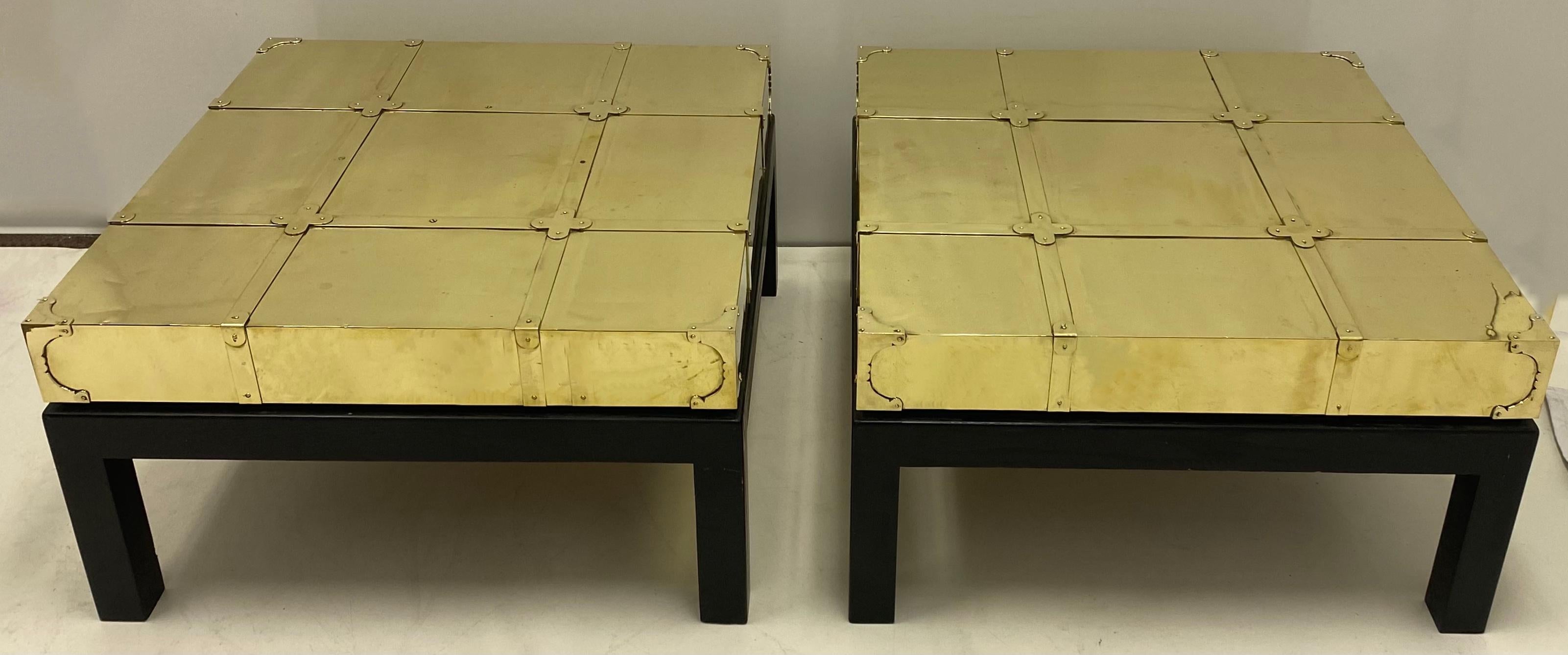 These Sarreid Ltd. side table date to the 1970s. They are unique in that they combine low profile modern styling with Asian and campaign influences. They are marked. The tables have been recently polished and will age into a deep antique brass look