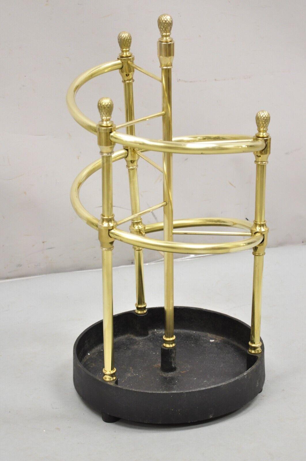 Sarreid LTD Victorian Style Polished Brass & Heavy Cast Iron Spiral Umbrella Stand. Circa late 20th Century Measurements: 25