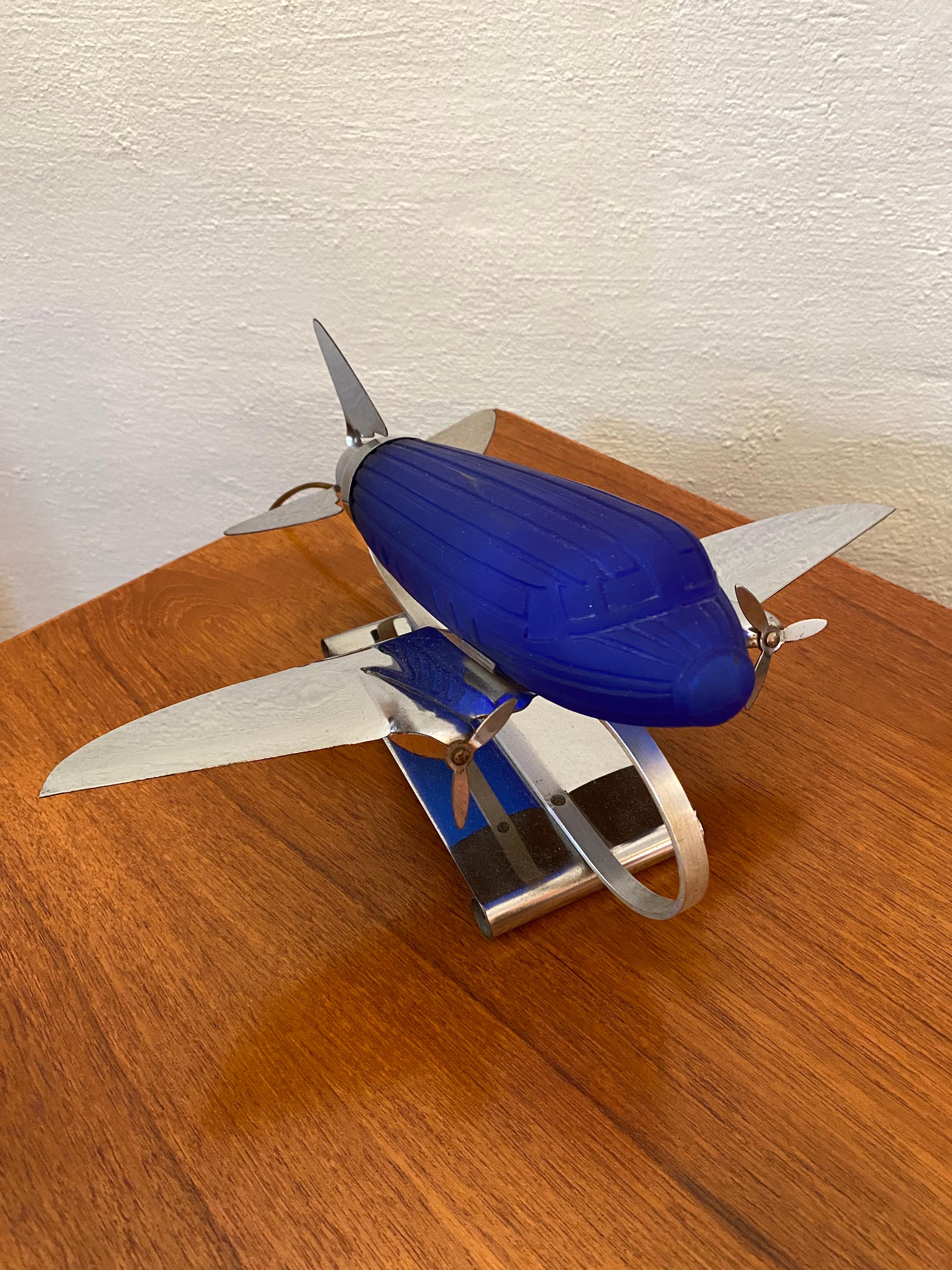 Sarsaparilla chrome and blue glass airplane lamp from the early 1980's all original and pretty clean. Sarsaparilla made a lot of deco inspired lamps and accessories in the 1970's and 80's.