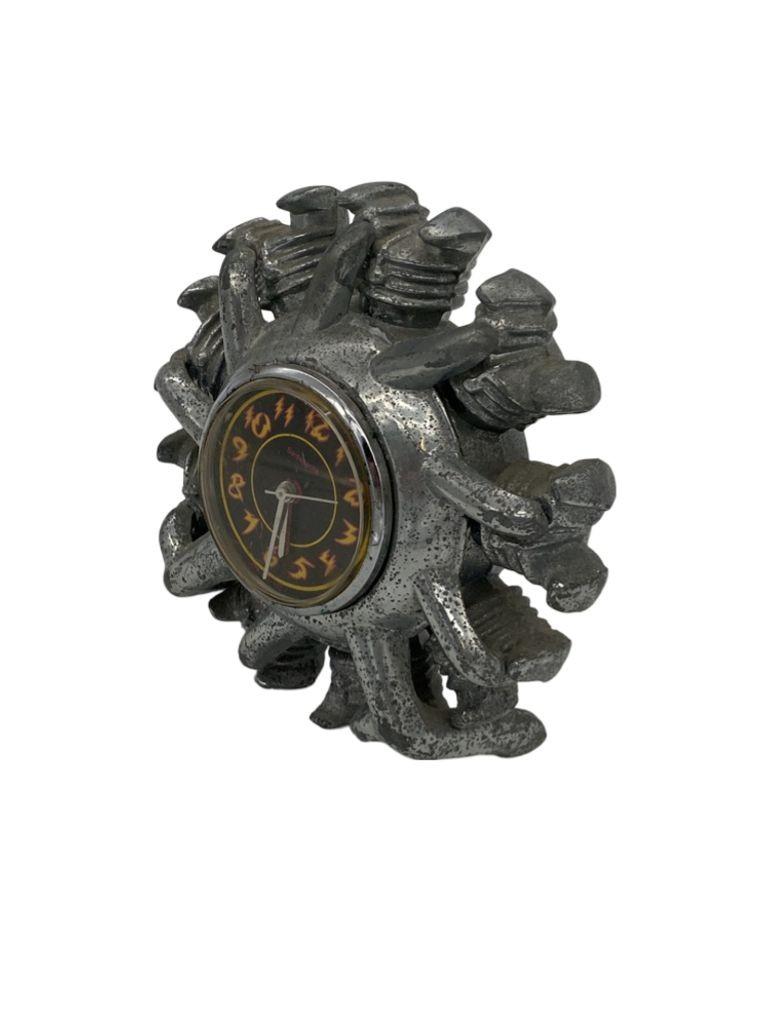 This is an Art Deco-style radial Airplane engine clock. It is dated 1993 and in excellent condition.

Clocks keep accurate time with single AA Battery. The heavy chrome case is very detailed and looks like an early 1930s radial engine found of