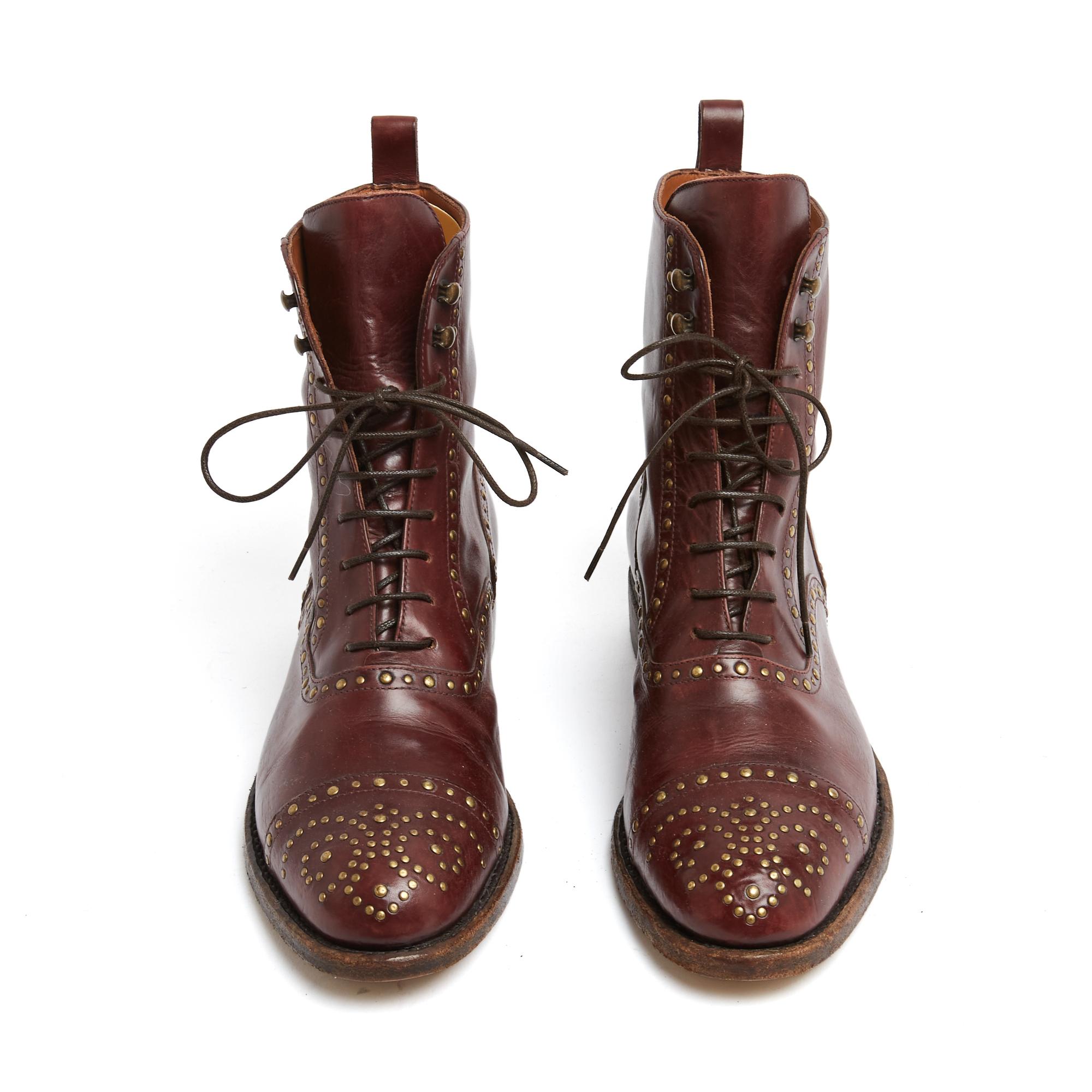 Sartore ankle boots in semi-glossy burgundy leather decorated with gold metal studs in a 