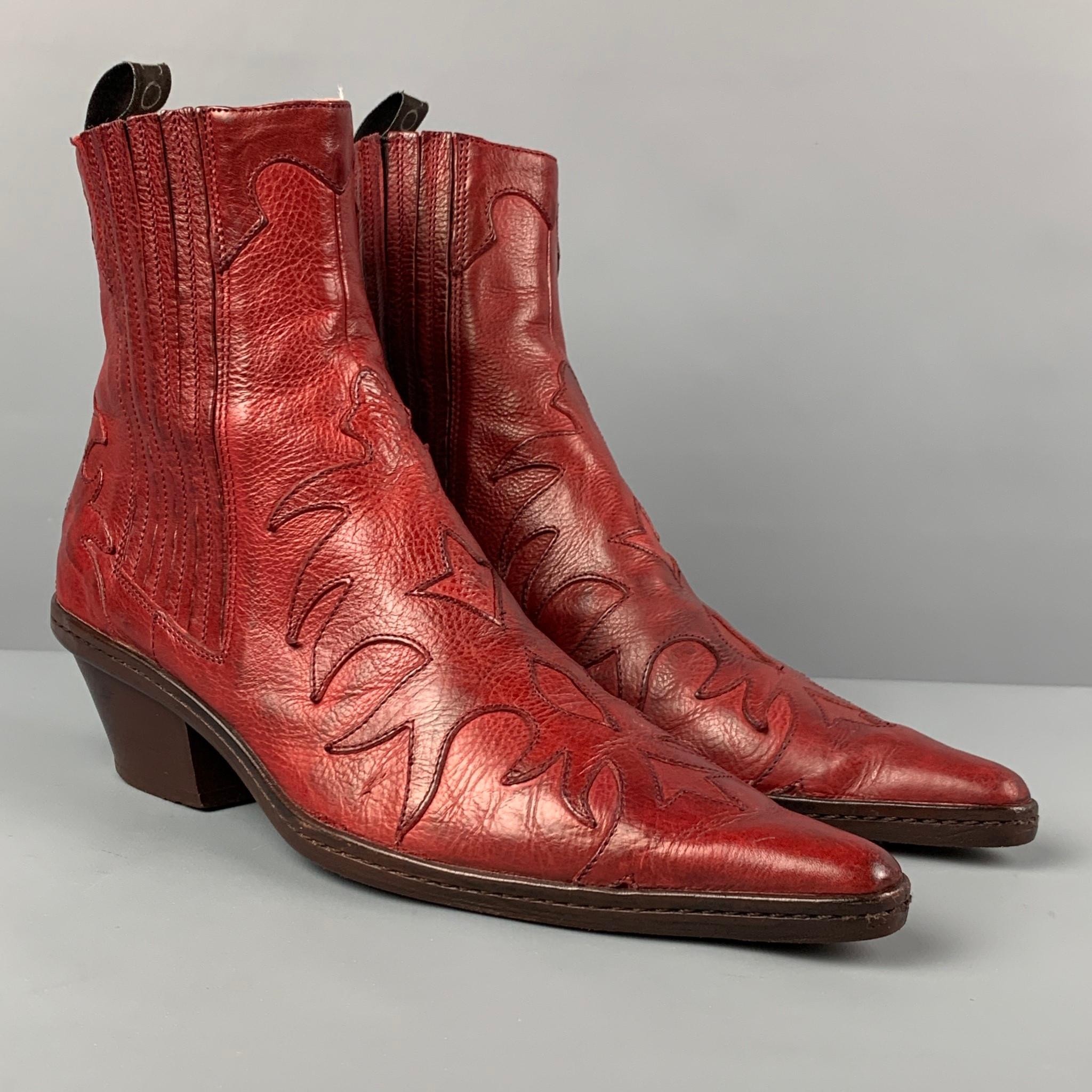 SARTORE boots comes in a red leather featuring a cowboy style, pointed toe, elastic detail, and a chunky heel. Made in Italy. 

Very Good Pre-Owned Condition.
Marked: 36
Original Retail Price: $596.00

Measurements:

Length: 9.5 in.
Width: 3.25