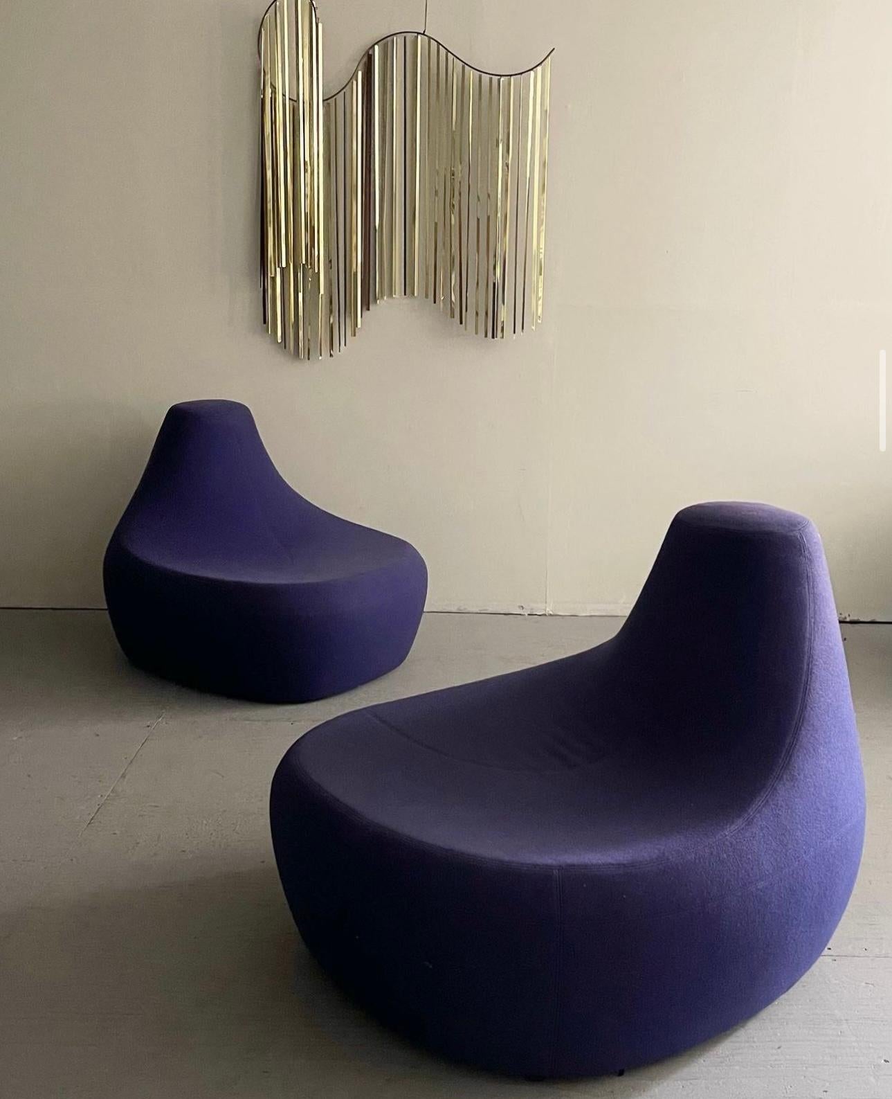“Saruyama” Island Lounge Chairs Designed By Toshiyuki Kita For Moroso. These uniquely designed vintage lounge chairs offer a geomorphic shape with seats wide enough to fit two people. Both come wrapped in their original deep purple upholstery. The
