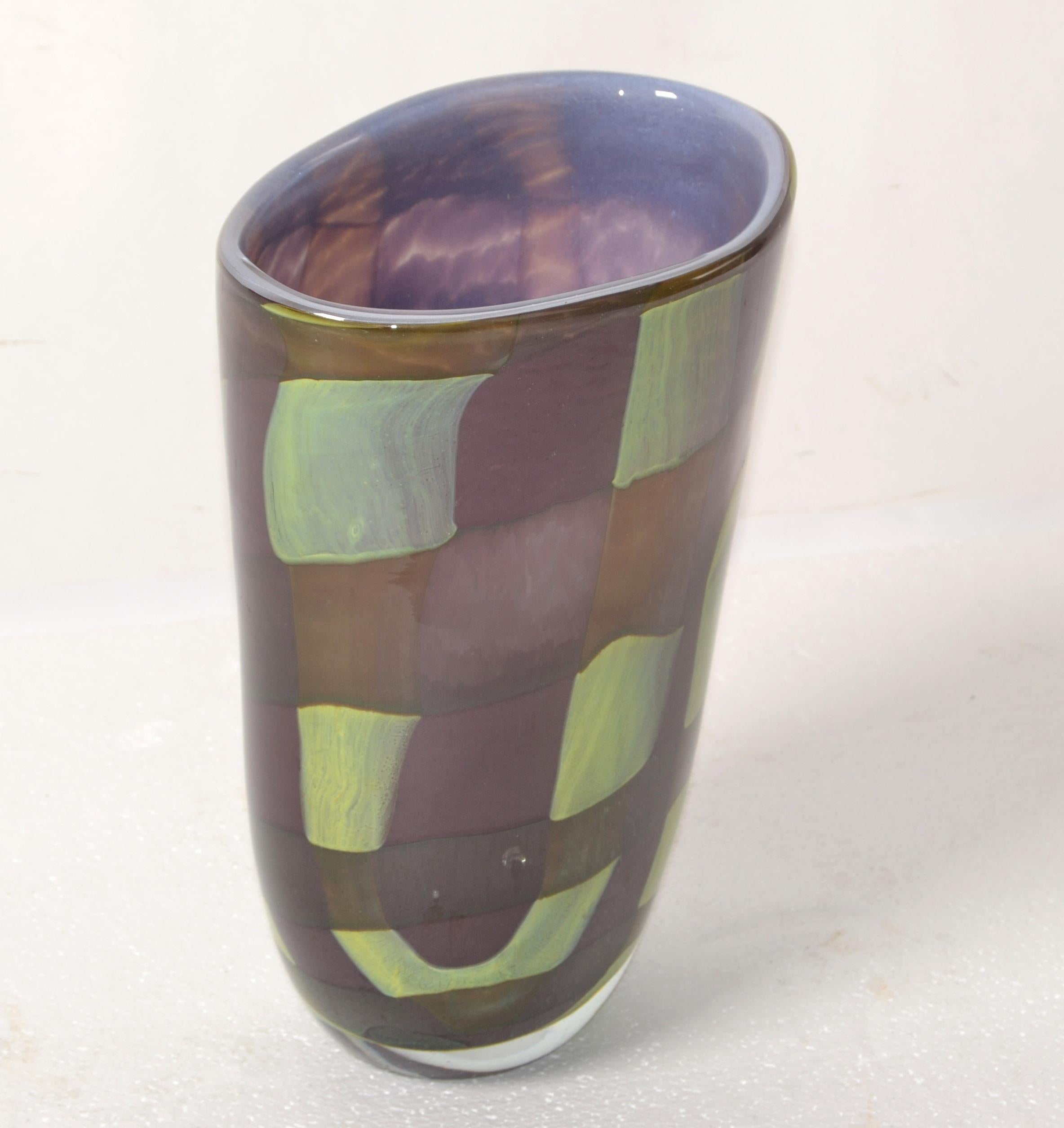 Sasaki Sengai oval encased Art Glass flower vase in Purple and hue of olive green and the light blue interior.
Minimalism Cubism Style Pattern and a very heavy Vessel, Centerpiece or Flower Vase.
Signed by Artist at the base.
In good vintage