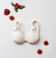 "Innocence" white porcelain lace brassiere with red roses wall installation