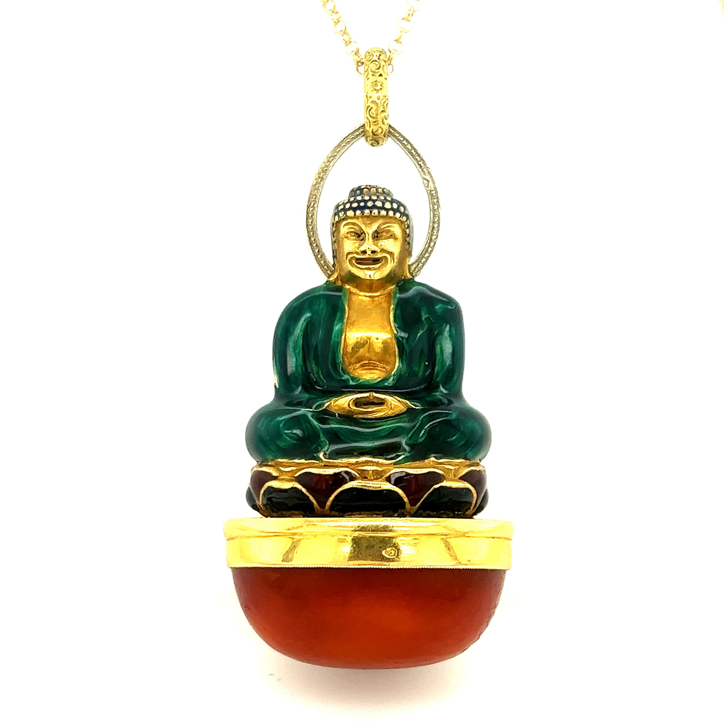 One of a kind art deco pendant crafted in 18k yellow gold. This rare piece of jewelry was master crafted by the famous Parisian atelier Sasportas.  The pendant is crafted in the form of a buddha resting peacefully atop a large cabochon cut amber
