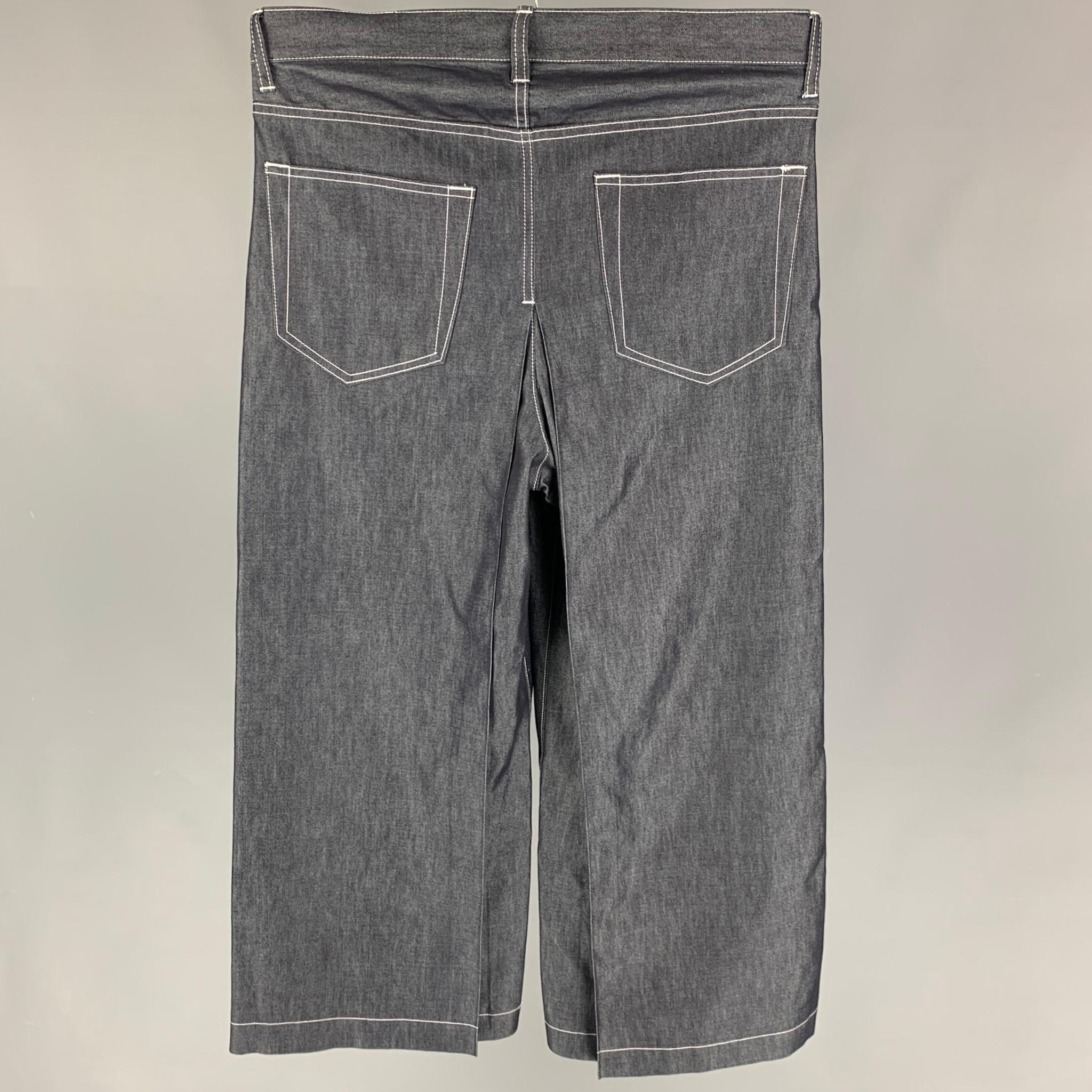 SASQUATCHFABRIX jeans comes in a indigo cotton featuring a wide leg, contrast stitching, and a zip fly closure. 

New With Tags. 
Marked: M

Measurements:

Waist: 32 in.
Rise: 13 in.
Inseam: 27 in. 