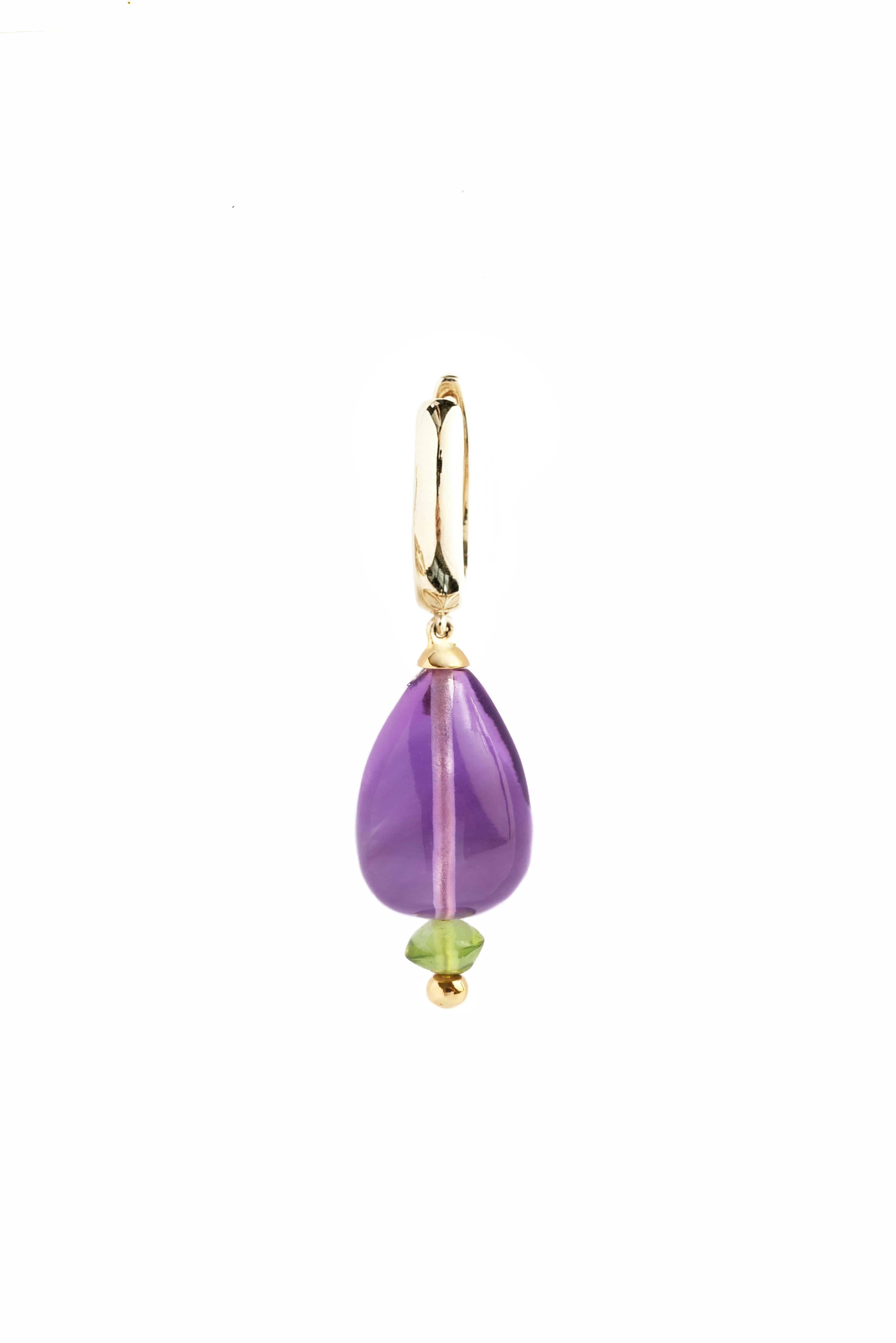 Introducing our Amethyst Drop and Peridot earrings, specially crafted for the modern woman seeking elegance and sophistication. These exquisite earrings feature stunning Amethyst drops accompanied by a Peridot and a gold bead, creating a striking