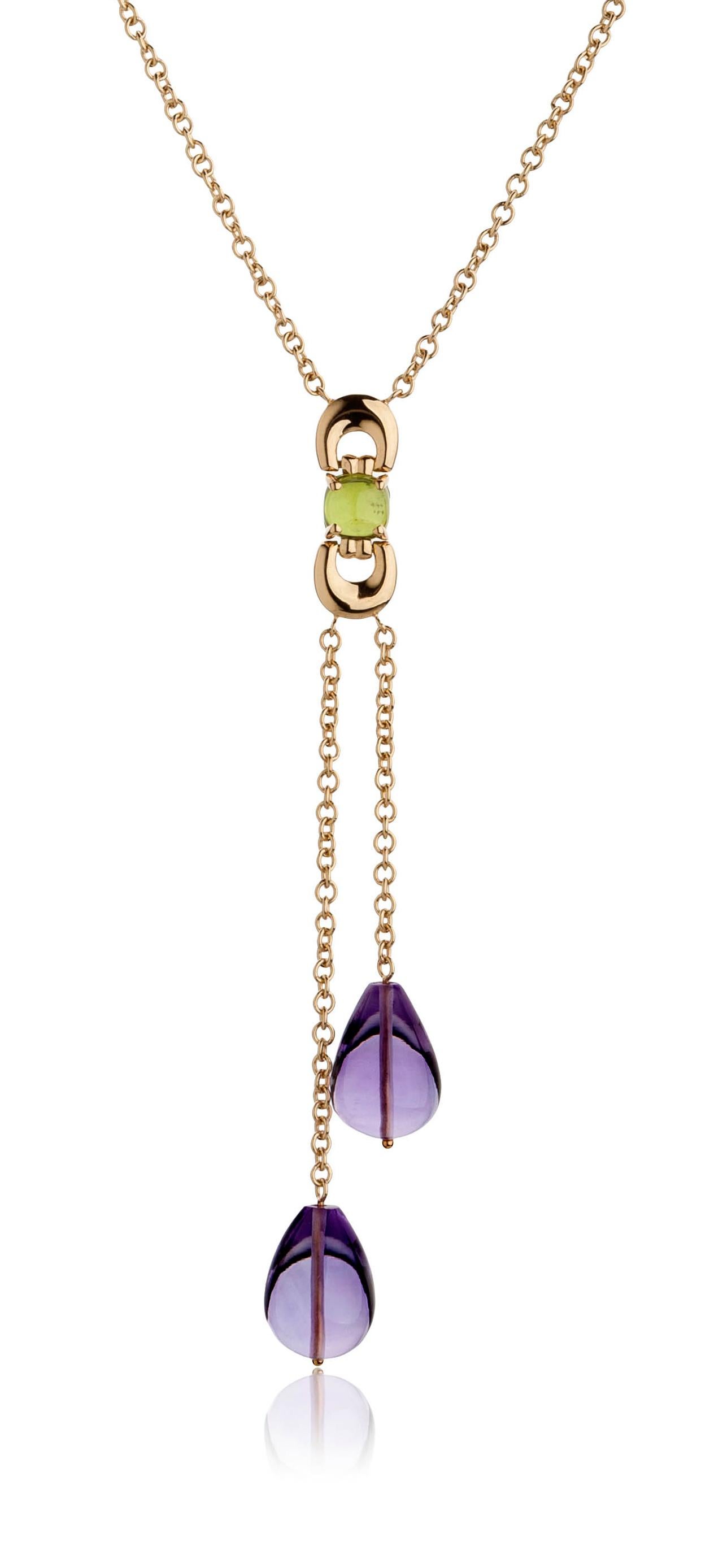 Designed to captivate and inspire, the Lariat Necklace from the Secret of Berenice Collection features two exquisite Amethyst drops in alluring violet hues. Ten cushion-cut Peridot gemstones are carefully set around 5 signature links of the Secret