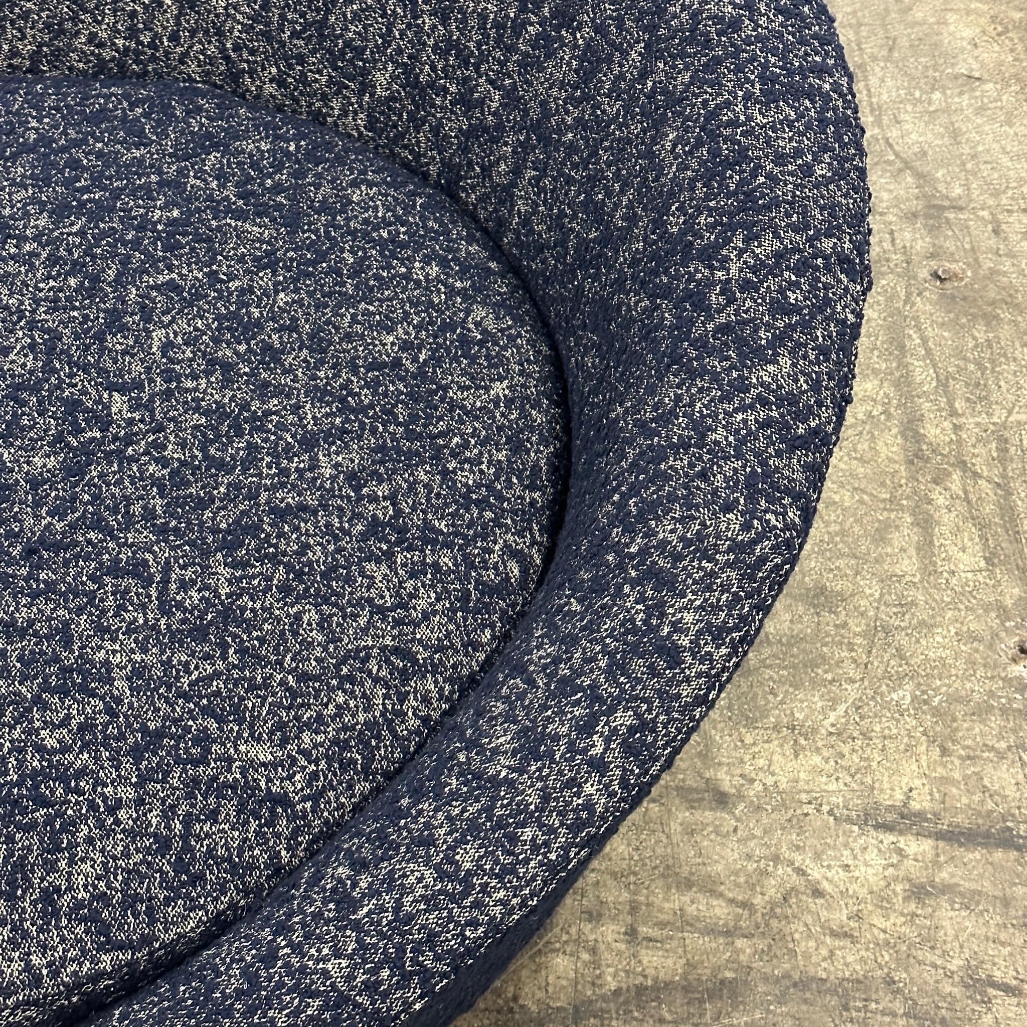 c. 1970s. Reupholstered in nubby navy boucle on top and navy vinyl on the base. New foam added for extra comfort. 