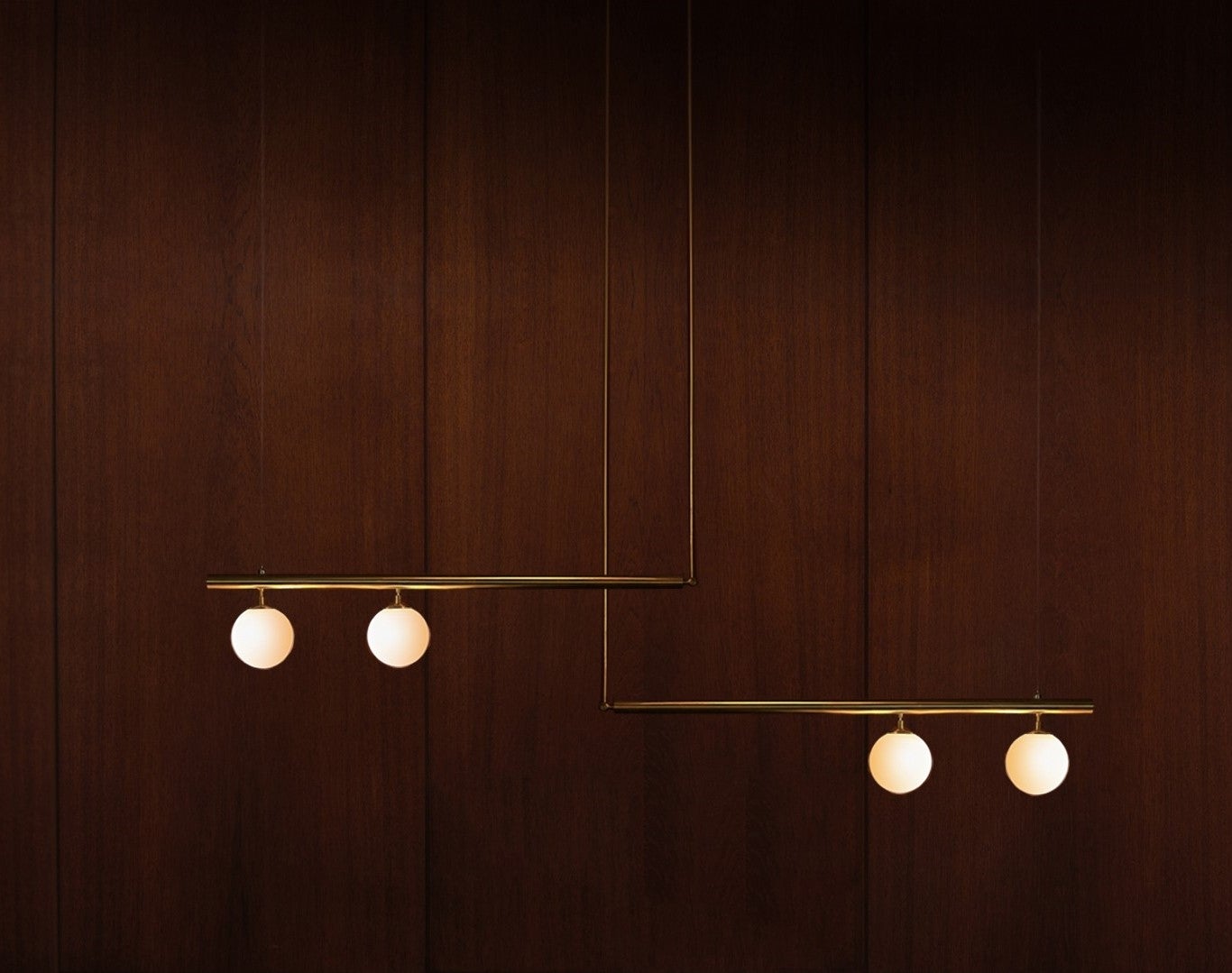 Satellite II + II, sculpted pendant by Paul Matter.
Dimensions: D 15 x W 246 x H 72.
Materials: Brass, glass.
Available in other finishes.

Satellite is inspired by the conceptual and Minimalist movement of the 1960s and 1970s. These light
