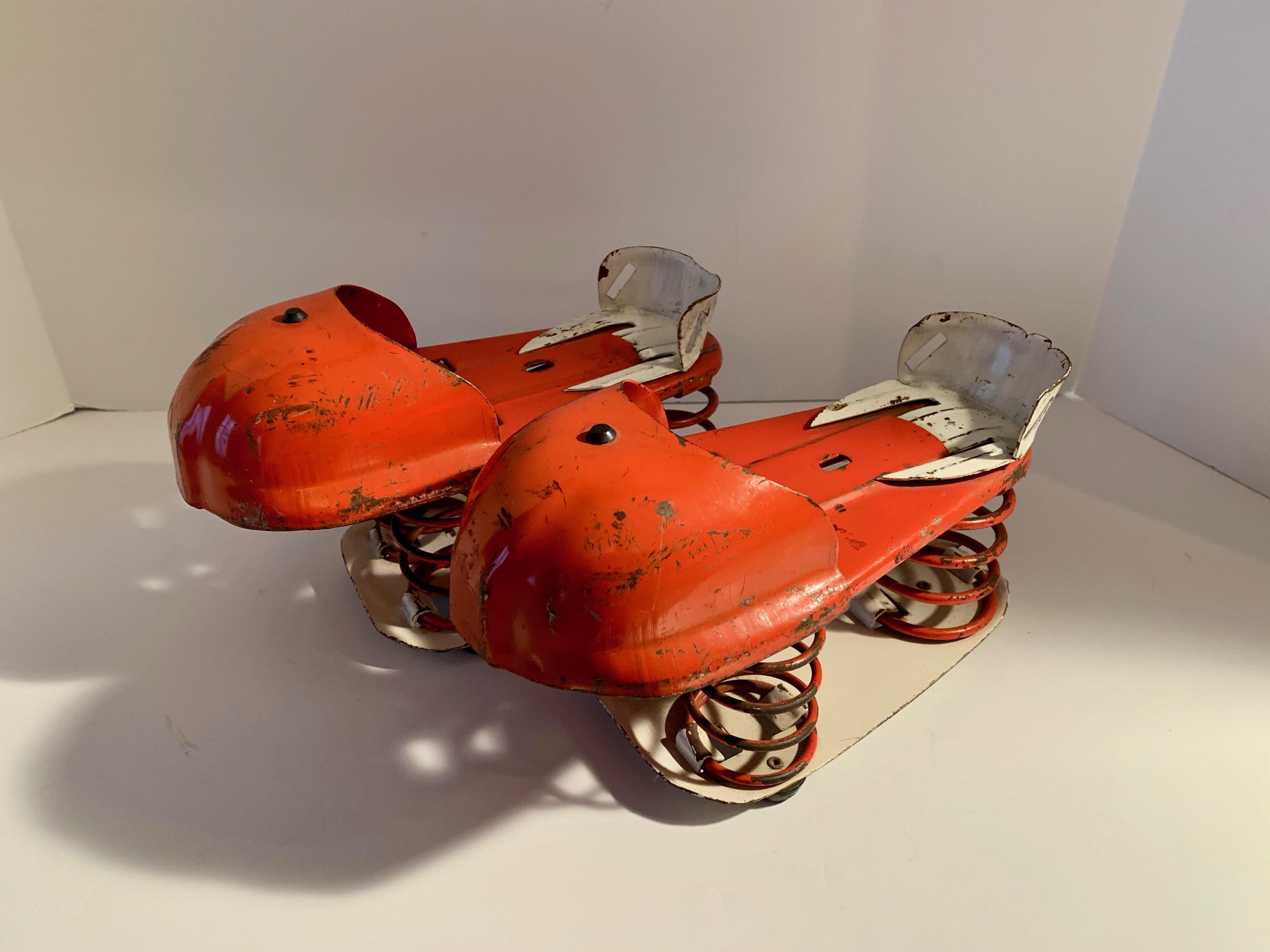 Originally designed to give the wearer the sense of weightlessness, however, we suggest using them as bookends or, quite simply, as art! Great condition. 
Also known as Bounce shoes.

Manufactured circa 1955.