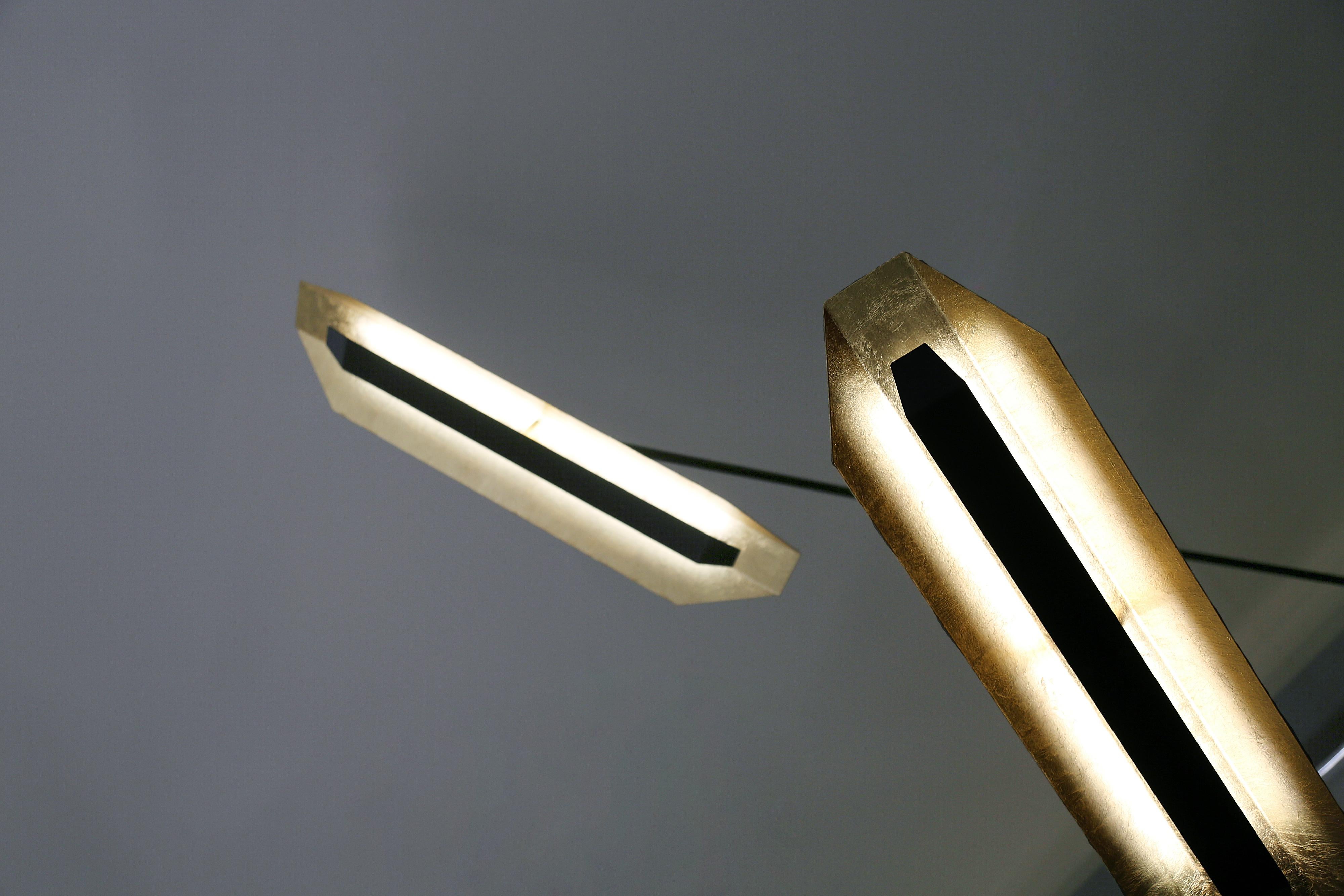 Satellite pendant light pendant by William Guillon and Pierre Mounier
Measures: Height Bespoke
Width up to 100 cm (for one arm)
Black painted steel, 24-carat golden leave
Hand sculpted in France

William Guillon:

William Guillon’s main