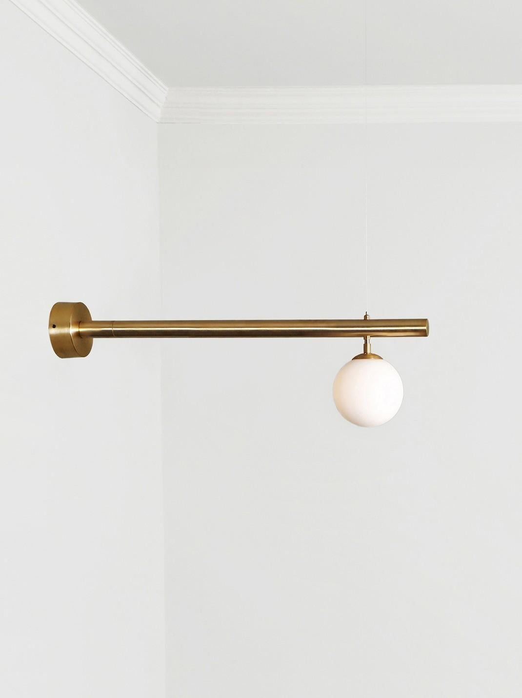 Satellite sconce by Paul Matter
Dimensions: W 94 x D 15 x H 27 cm
Materials: Brass.
Available in different finishes.

Satellite is inspired by the conceptual and minimalist movement of the 1960s and 1970s. These light sculptures are