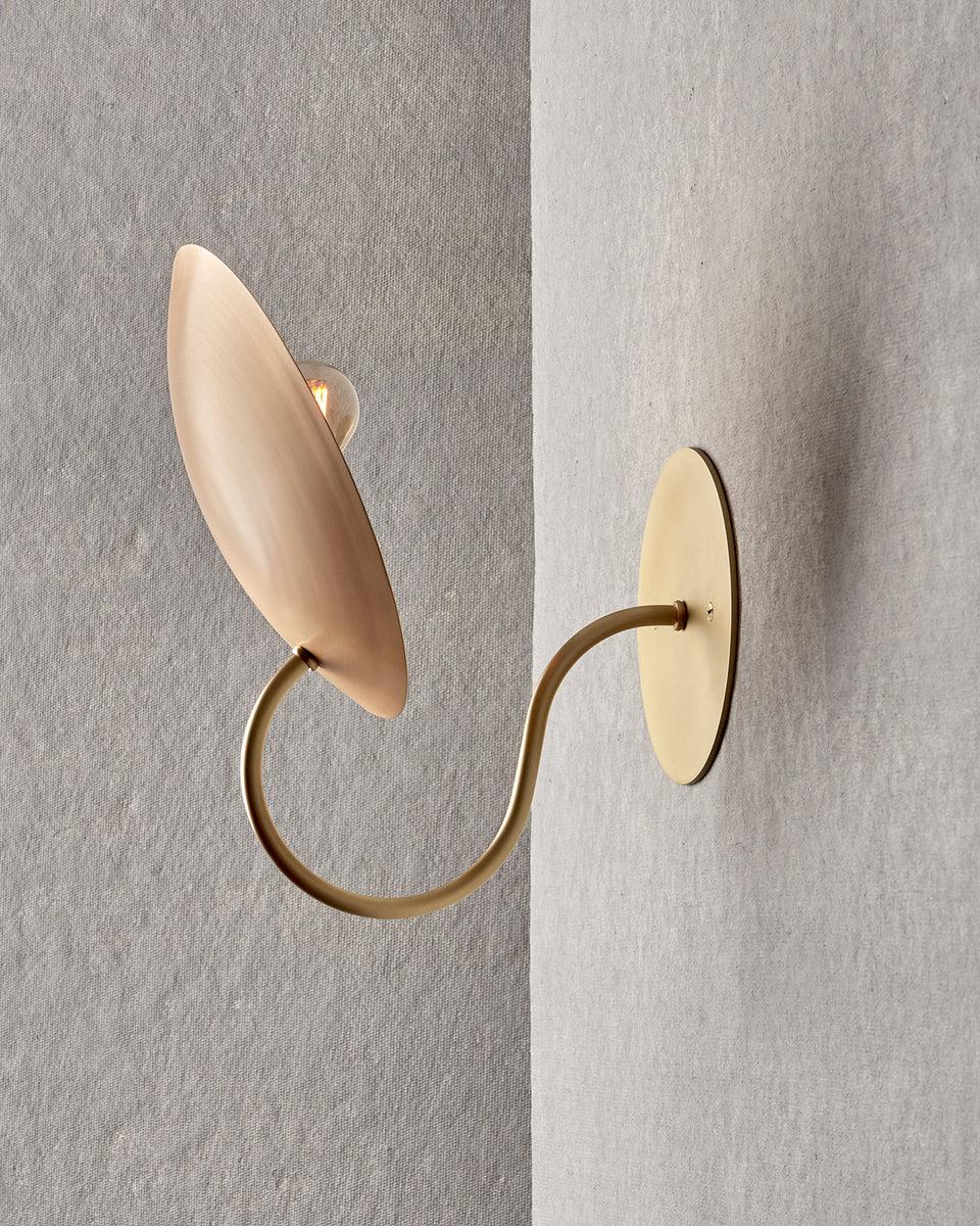 The Arlo Sconce features a spun bronze reflector affixed to a curved brass arm, complimenting any space with warmth and subtlety.

OVERALL DIMENSIONS
9