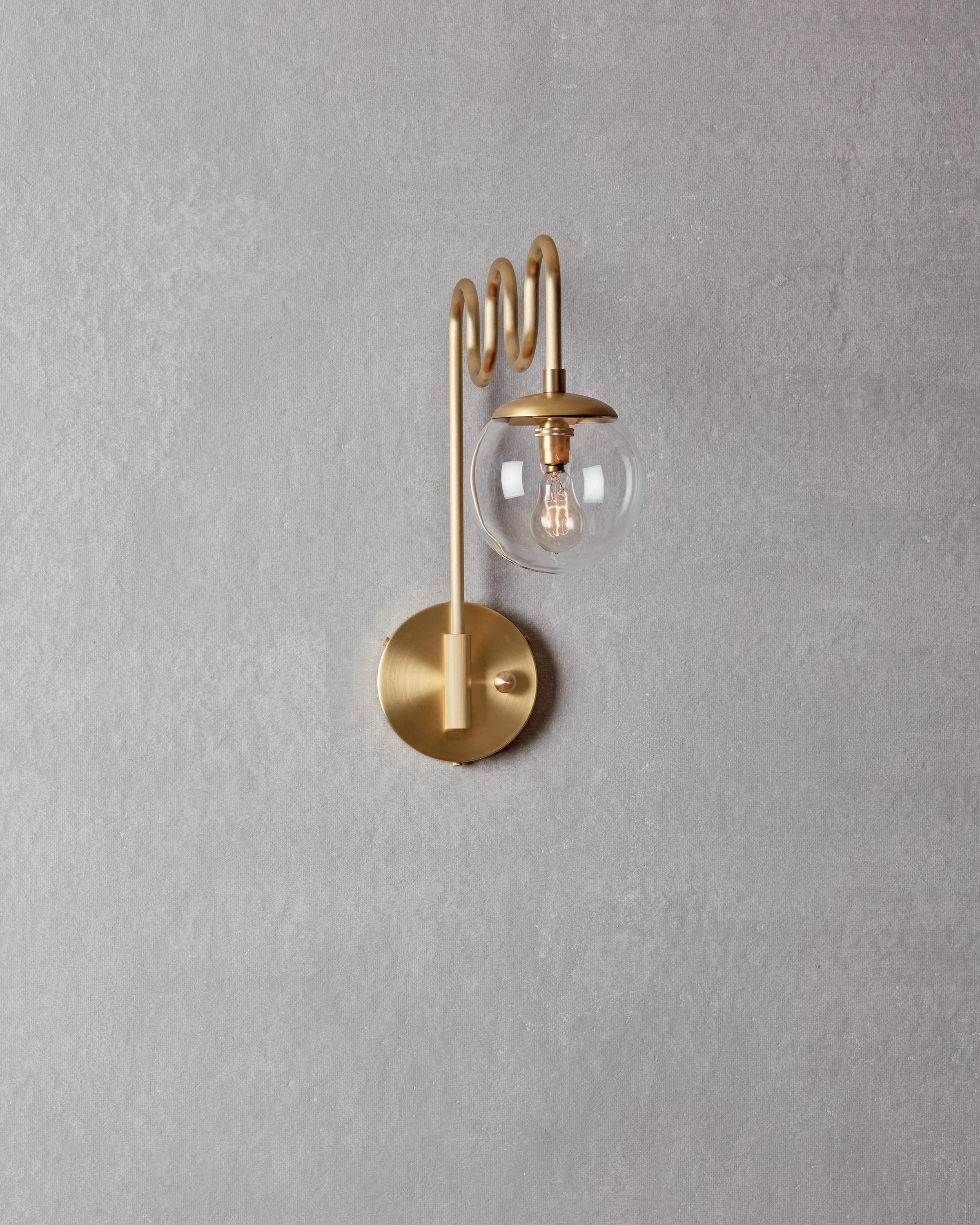 Modern Satin Brass Cecil Sconce - Clear Glass Globe For Sale