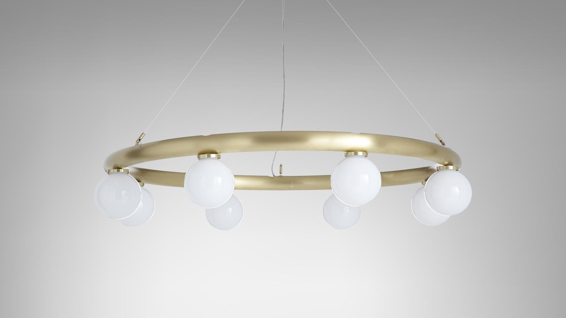 Orb pendant by CTO Lighting
Materials: Satin brass, opal glass shades, stainless steel suspension wire/clear flex
Dimensions: W 120 x D 120 x H 20 cm 

8 x G9, 25w max halogen (or 2.3w LED 2700k)
weight 11kg (24.3lbs)
supplied with 2000mm