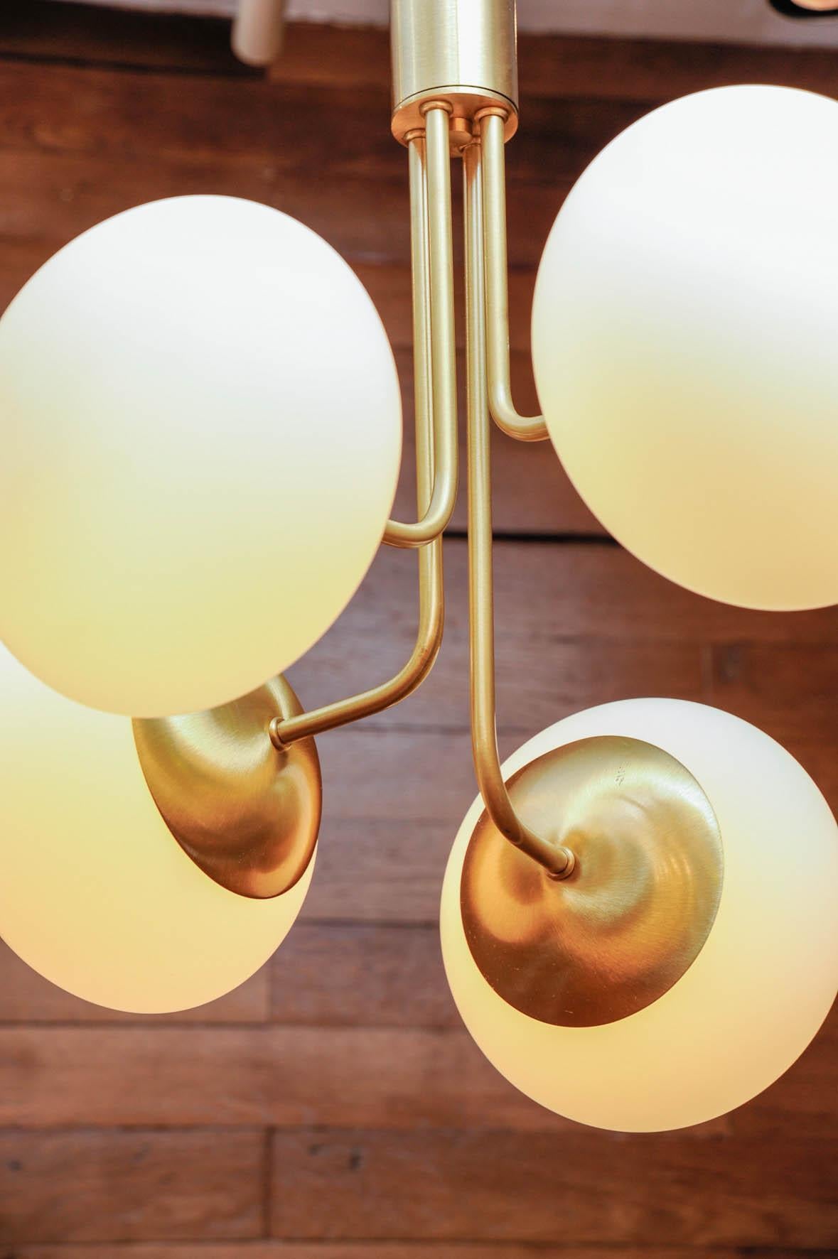 Contemporary Satin Brass Suspension with Four Lights and Round White Glass Globe