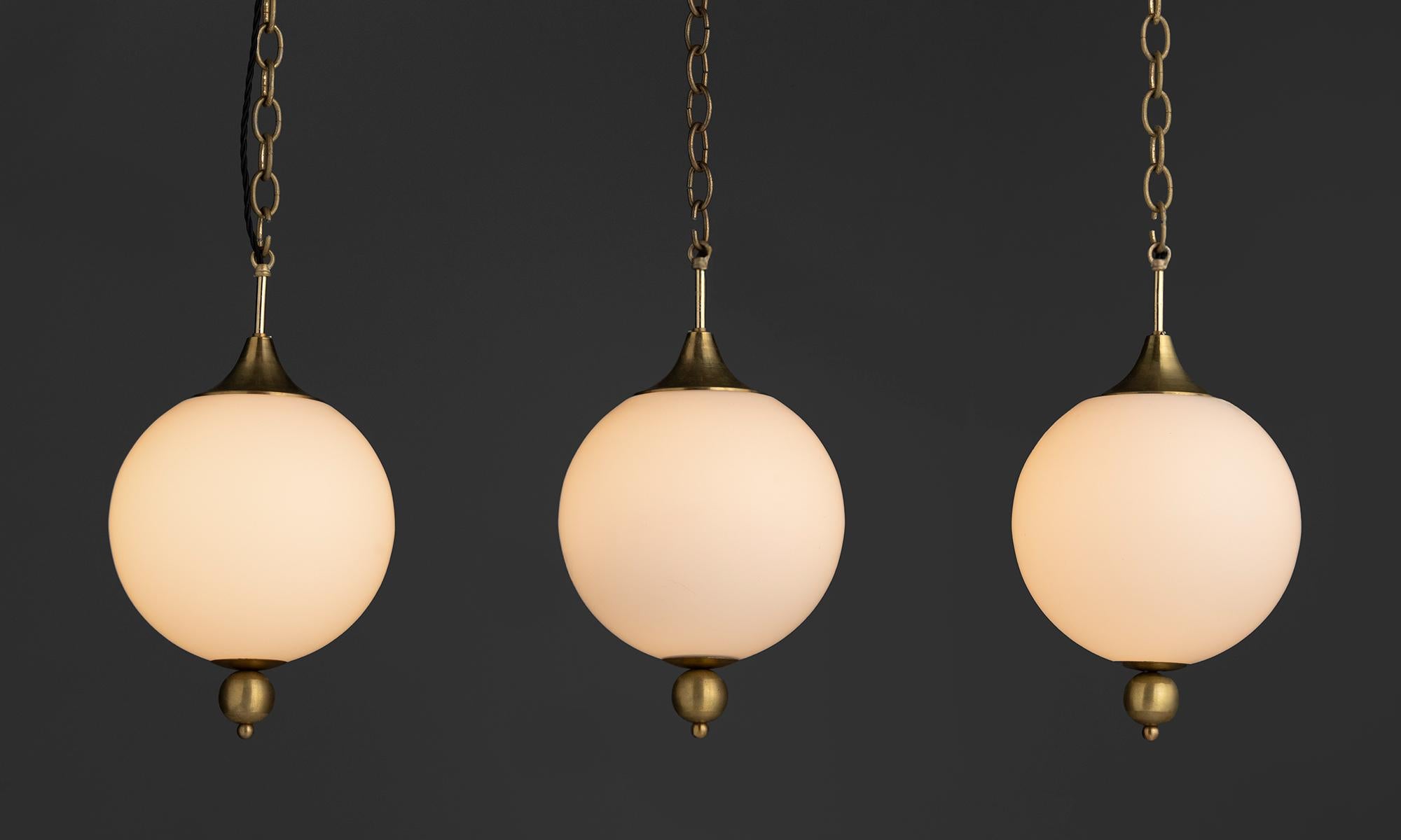 Netherlands, 1960
Opaline glass pendants with brass hardware.
9.5