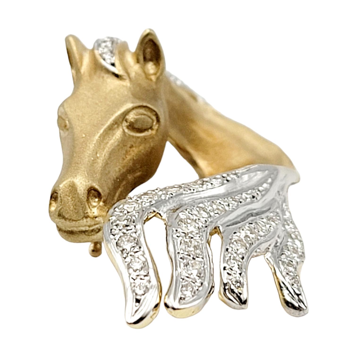 Calling all equestrian lovers! This incredible horse head pendant is a wearable work of art.  With its intricately carved design and sparkling natural diamonds, this rare and decorative piece will make a stunning statement and a wonderful