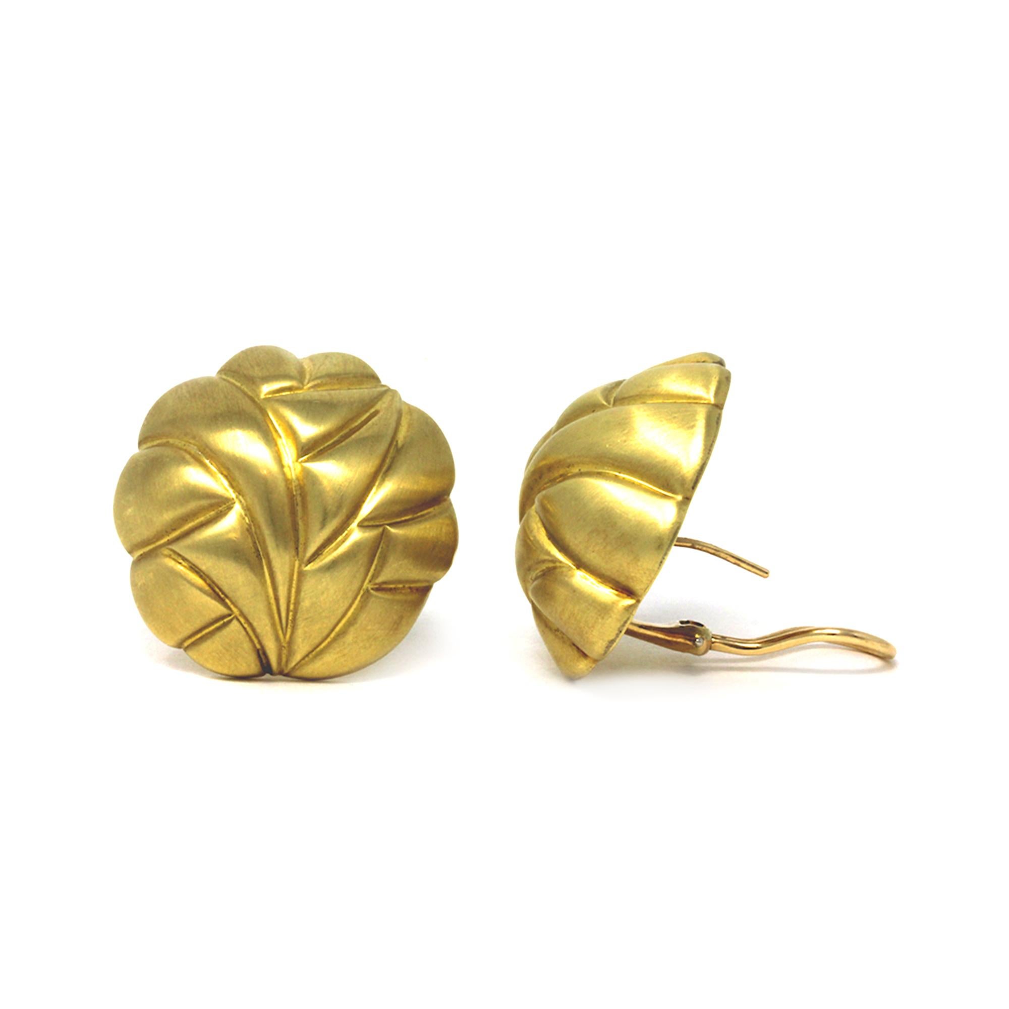 Pair of 18-karat yellow gold textured clip-on earrings of dome design with an abstract motif,
Brushed flat satin finish surface and high polish smooth inner face.
Gross weight 20.3 grams, measuring 1.13 inches in diameter and stamped 18k.
Omega
