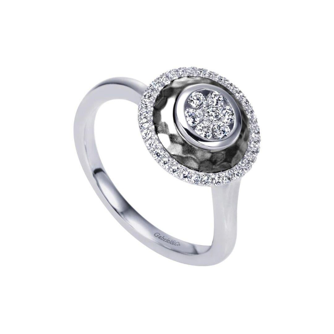 
Elegant diamond fashion ring with satin and hammer finish. Ring features pave set round brilliant cut white diamonds, H-I color, SI clarity, 0.25 ctw.
