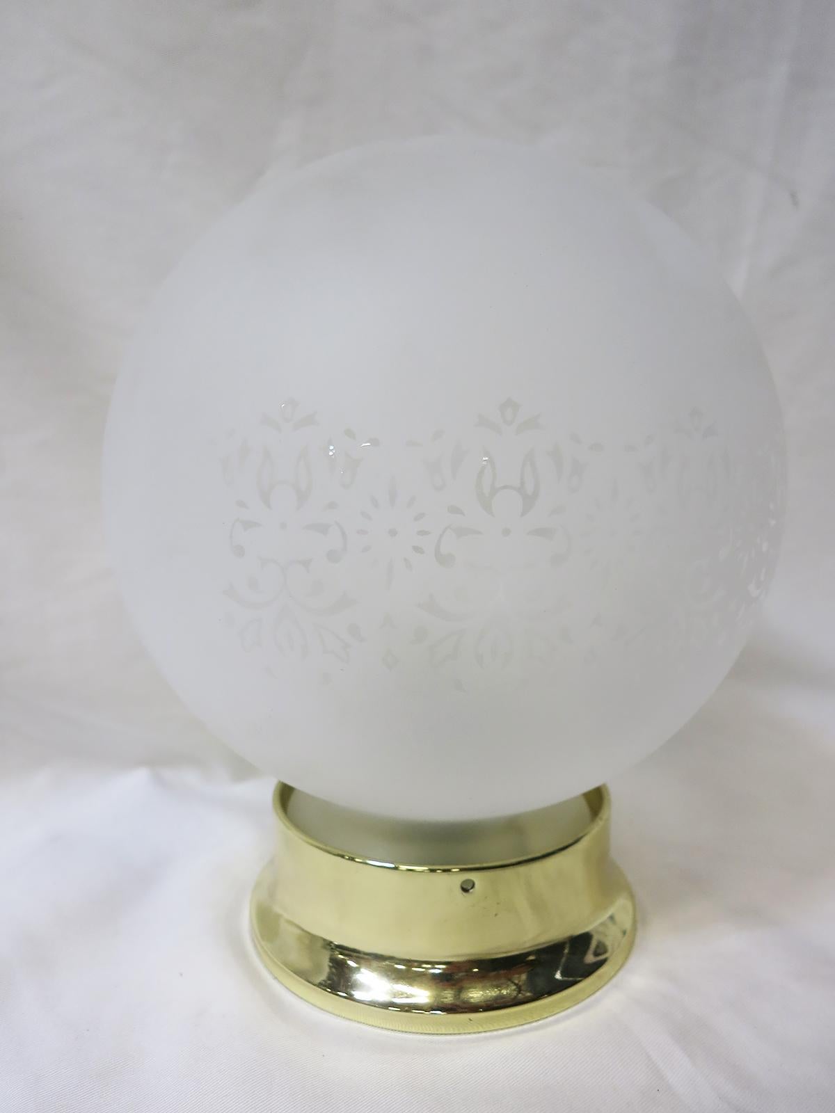 This unique and exquisite art nouveau-inspired satin glass globe features an etched floral garland pattern detail that will add endless charm to any home. Available with a new Brass or Chrome 4