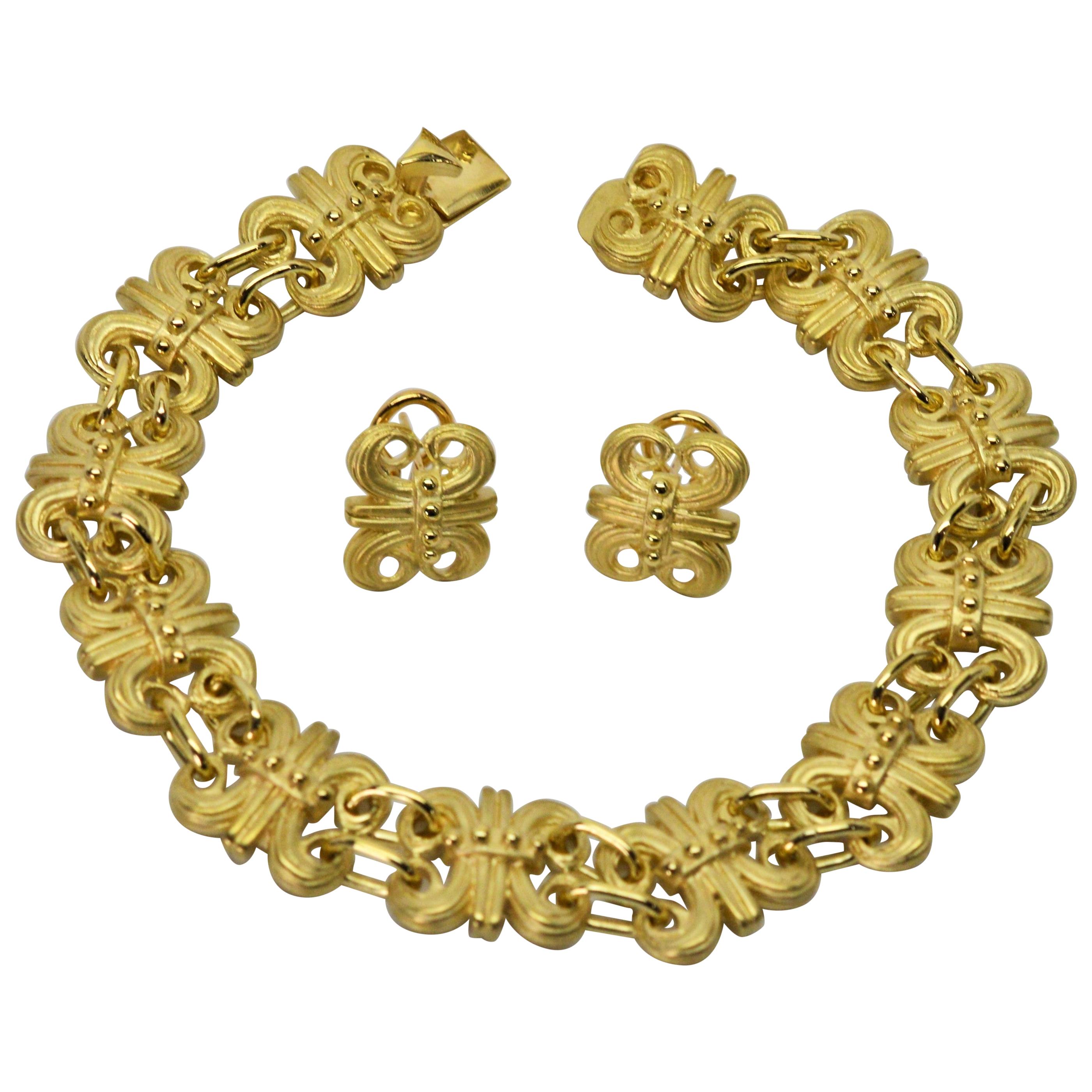 Satin 14 Karat Gold Fleur-de-Lis Bracelet and Earring Set For Sale