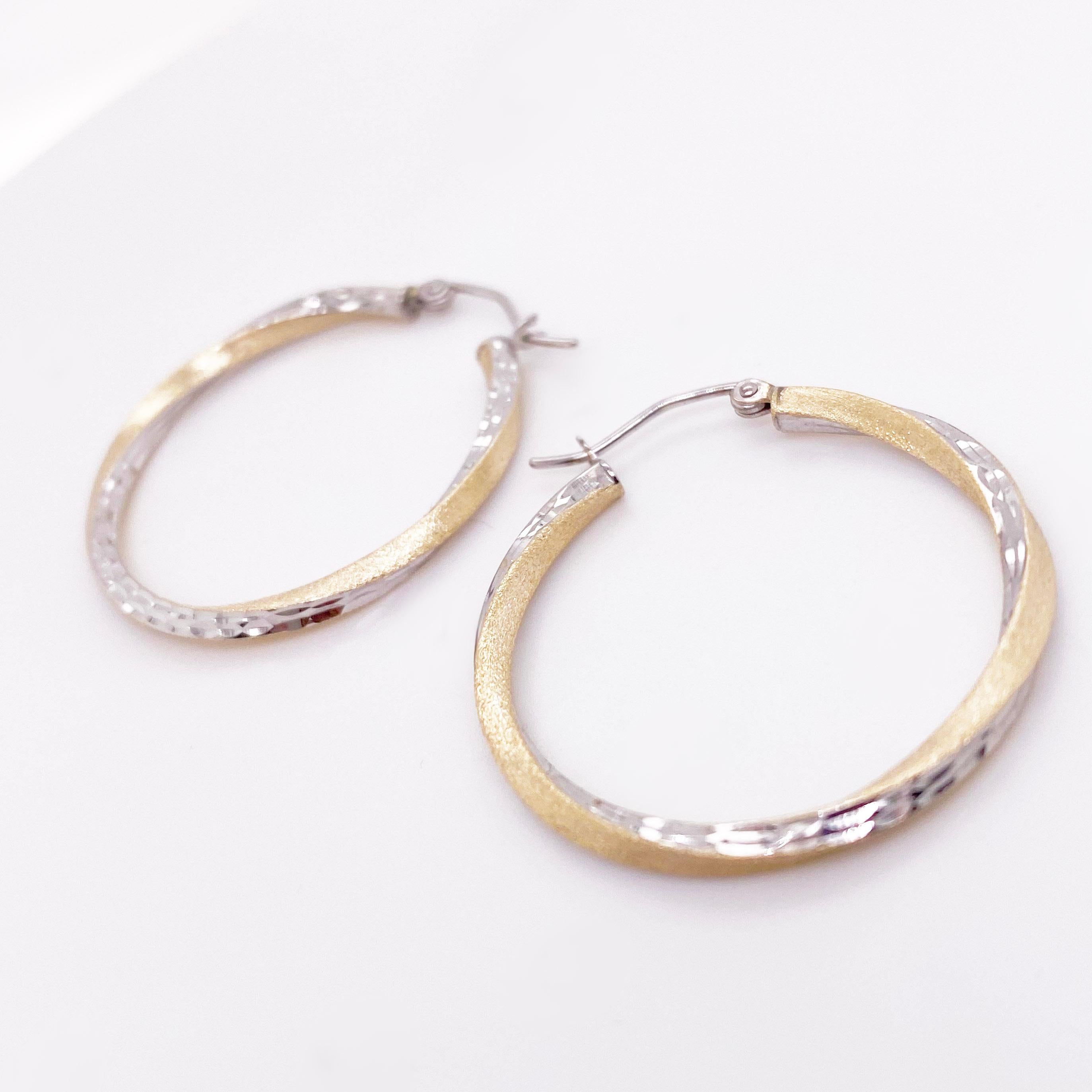 Gold hoop earrings are a staple in fine jewelry! These classic earrings are timeless and upgrade any outfit! The 14 karat yellow gold and white gold hoops are lightweight and comfortable to wear. They have a high polish white gold finish and satin