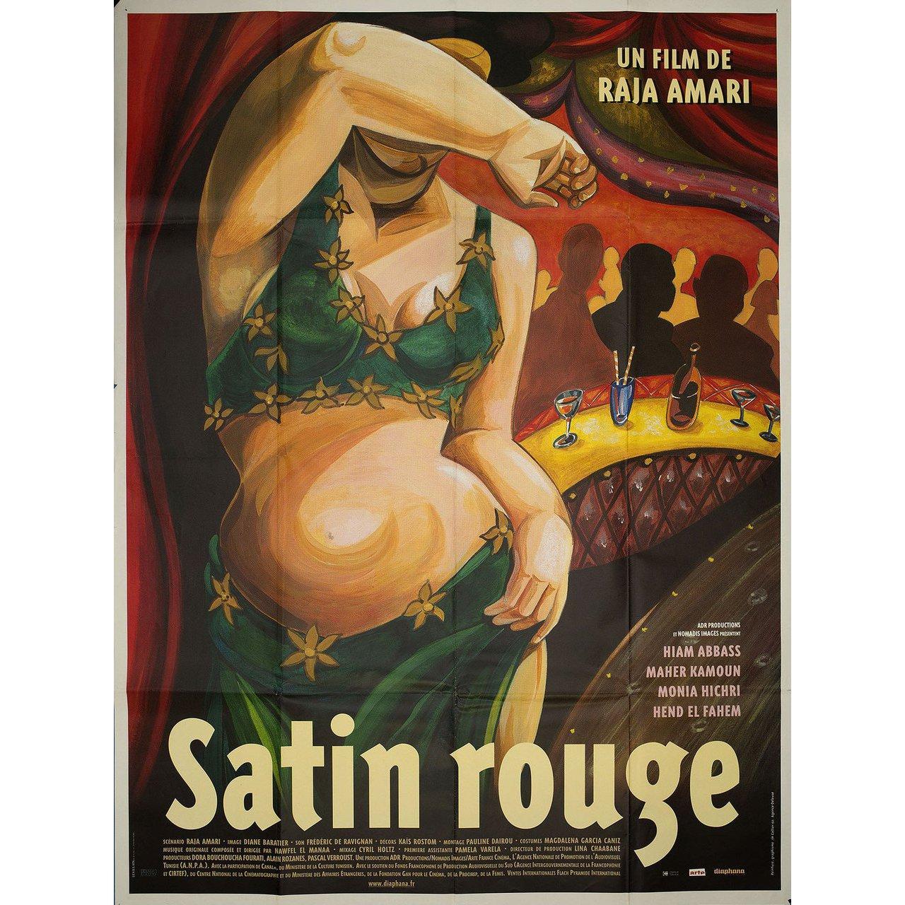 Grande affiche française originale de 2002 pour le film Satin Rouge (Red Satin) réalisé par Raja Amari avec Hiam Abbass / Hend El Fahem / Maher Kamoun / Monia Hichri. Très bon état, plié. De nombreuses affiches originales ont été publiées pliées ou