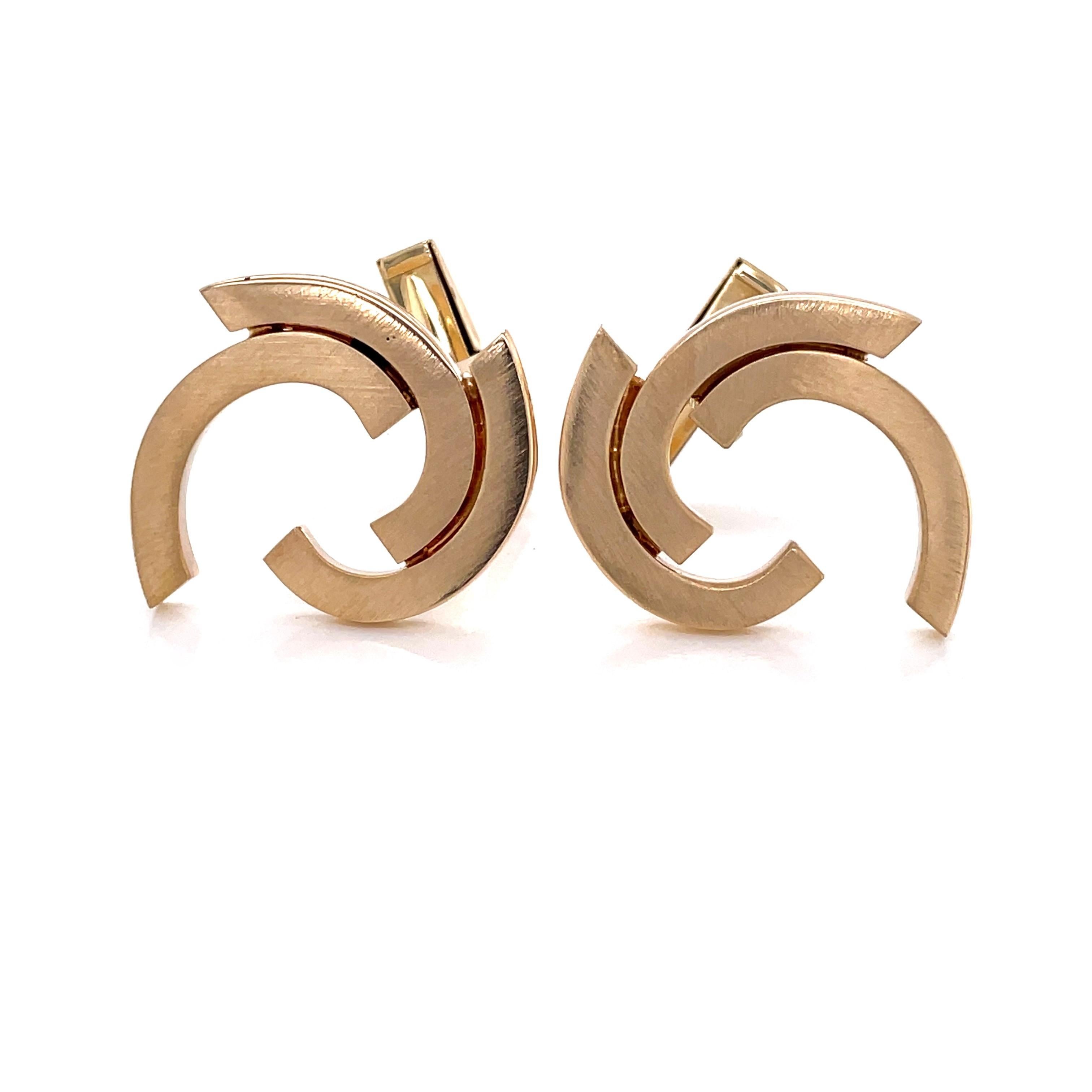 The intriguing modern curves of satin fourteen karat 14k yellow gold create an interesting detail for fine dressing with this cuff link pair. These fine unisex cuff links measure approximately 23.5mm x 20mm and are fitted with whale back toggles.