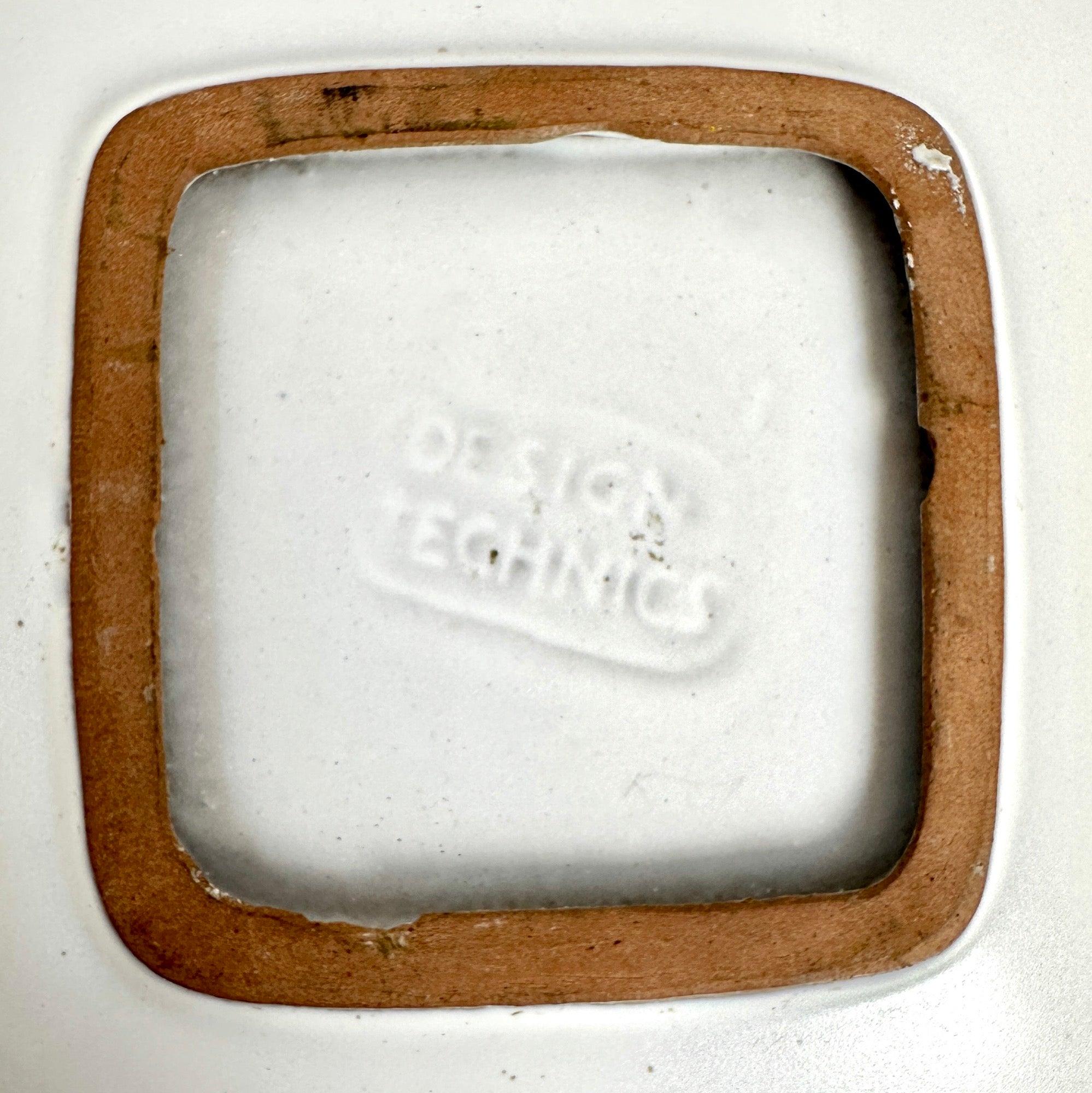 a low square bowl with radius corners in eggshell glaze.